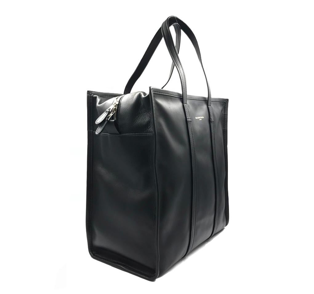 Balenciaga’s black Bazar shopper M bag comes in a subtly distressed finish for the new season. It’s crafted in Italy from mid-shine naturally creased lamb leather, to a rectangular shape with two top handles and a detachable and adjustable shoulder