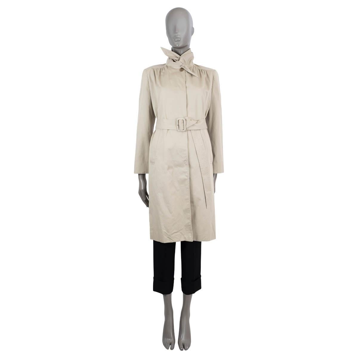 100% authentic Balenciaga scarf trench coat in gaberdine cotton (100%). Features an oversized collar that can be tied like a neck scarf, matching belt, two slant pockets and gathered shoulders. Closes with concealed buttons on the front. Lined in