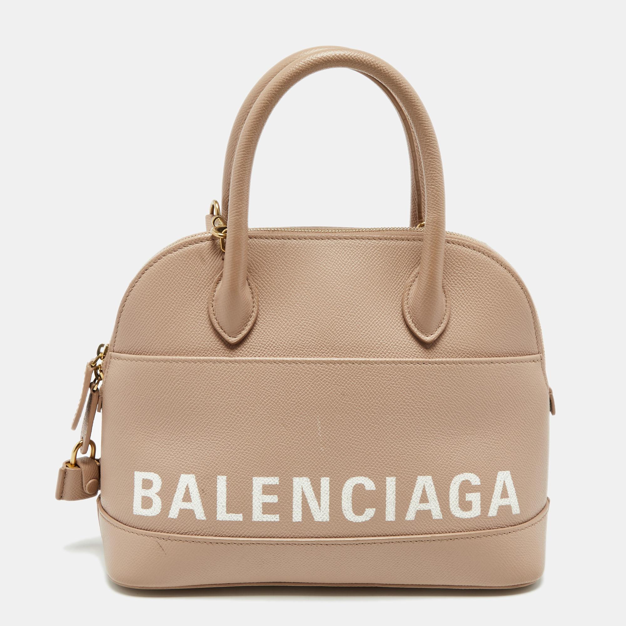 Easy to carry and stylish in appearance, this Ville satchel from the House of Balenciaga will certainly be your favorite pick this season. It is crafted using beige leather, with gold-tone hardware elevating its beauty. It provides two handles and a