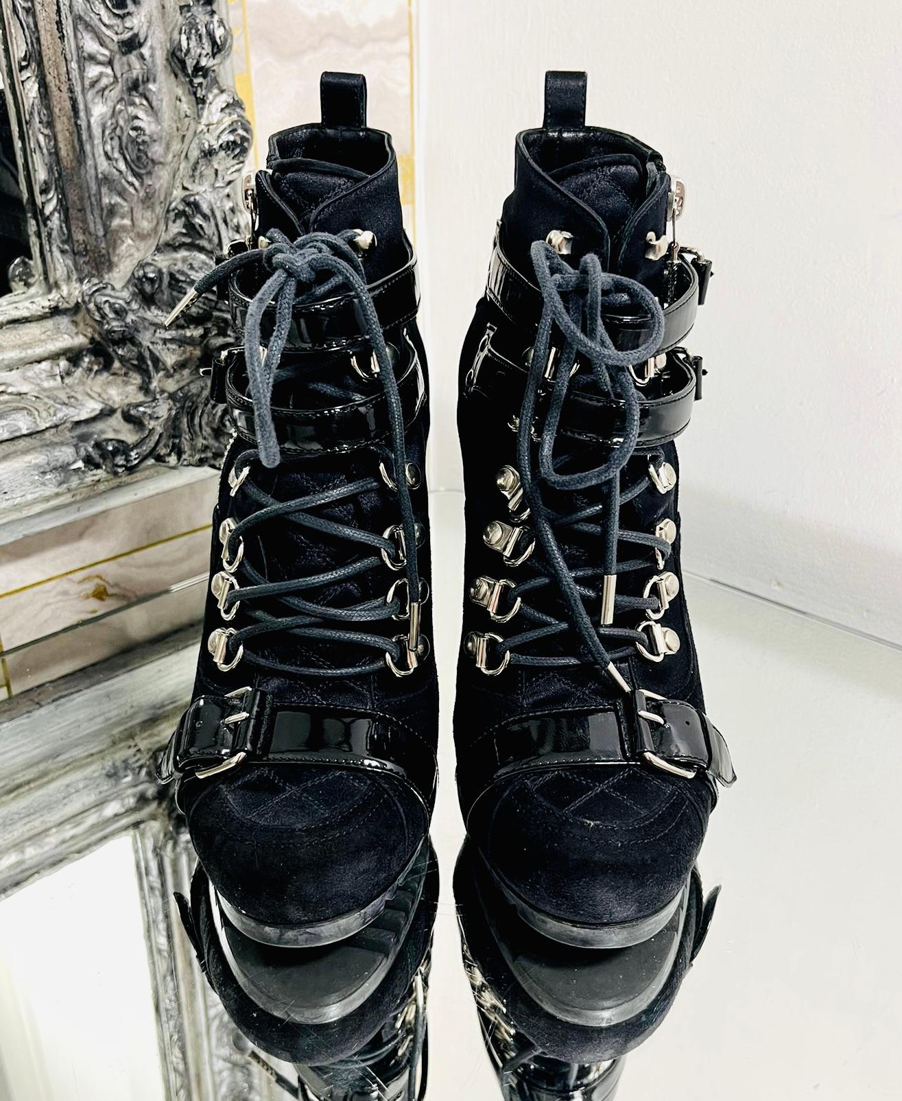 Balenciaga Biker Ankle Shoe/Boots

Black, lace-up boots designed with patent leather buckle detailing.

Featuring round toe and zip fastening to the side.

Satin and suede inserts with high stiletto heel.

Size – 37

Condition – Very