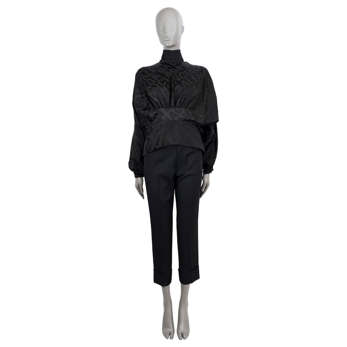 100% authentic Balenciaga all-over logo jacquard satin blouse in black viscose (54%), polyester (34%) and elastane (2%). Features a high-neck, cinched details at the front and back. Self-ties at the back. Opens with a zipper in the back. Unlined.