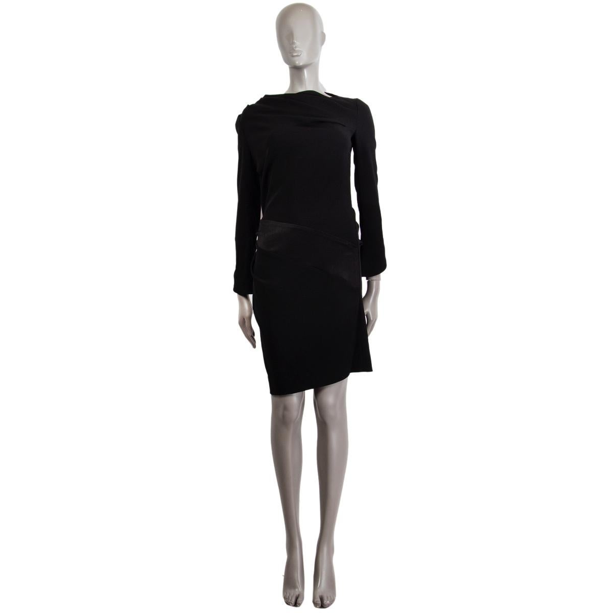 100% authentic Balenciaga long sleeve sheath dress in black triacetate (80%) and polyester (20%) with a draped jewel neckline. Has a diagonal triacetate panel detail around the waist. Closes on the side with a zipper. Unlined. Has been worn and is
