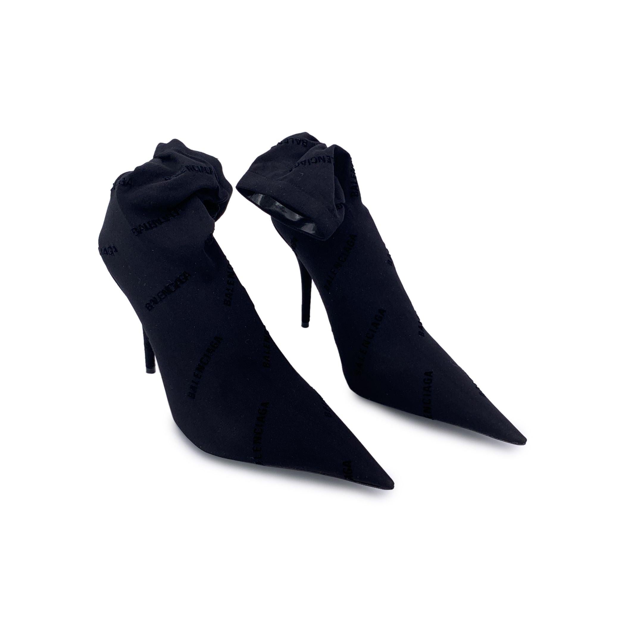 Step into high fashion with the Balenciaga 'Naked' Sock heeled booties-an iconic blend of sleek design and luxury craftsmanship. Made in Italy, these stunning boots feature a textile upper with a signature allover logo detail, paired with a smooth