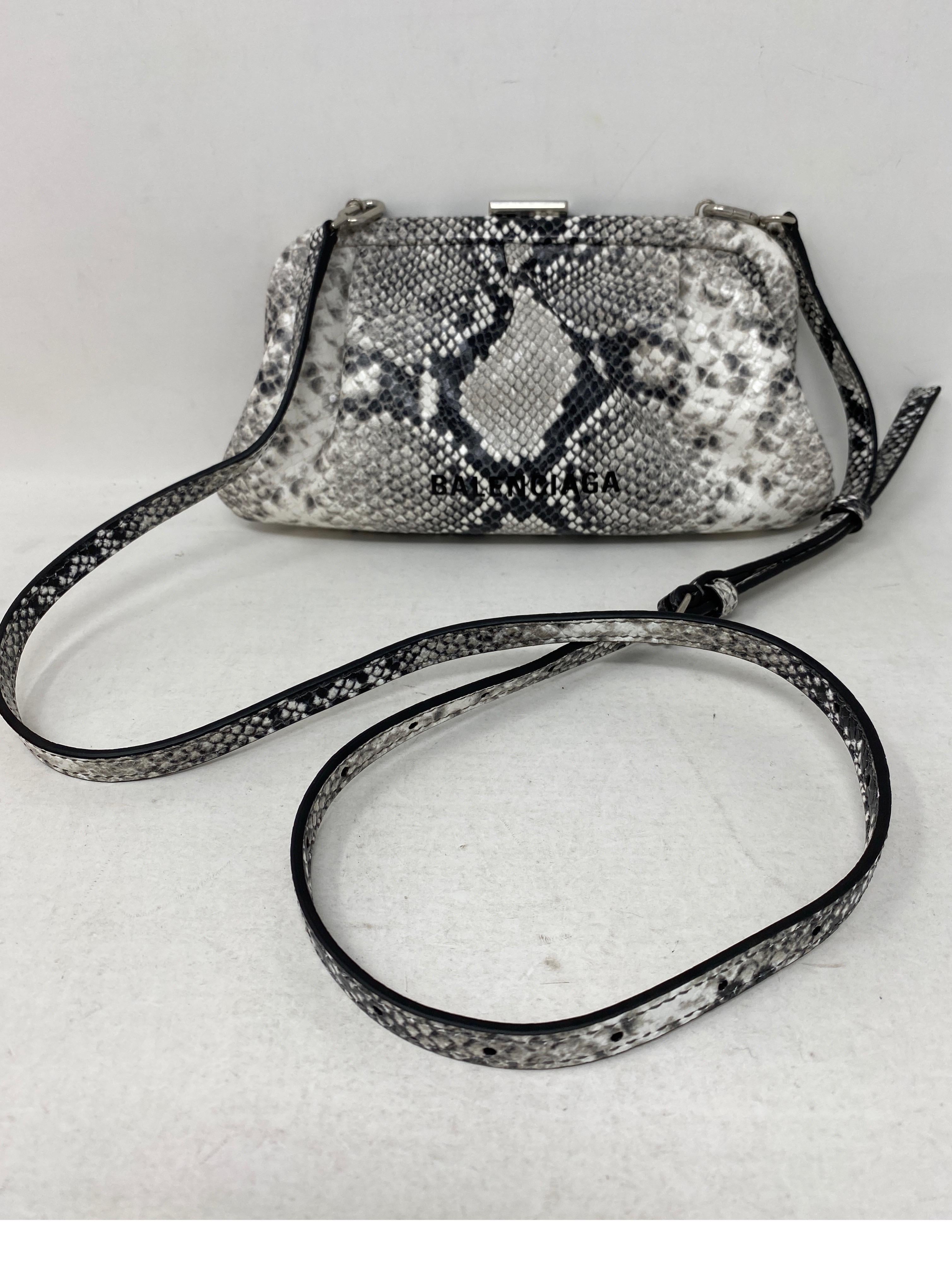 Balenciaga Black and White Crossbody Bag. Silver top handle. Can be worn as a clutch or as a crossbody bag. Mint like new condition. Guaranteed authentic. 