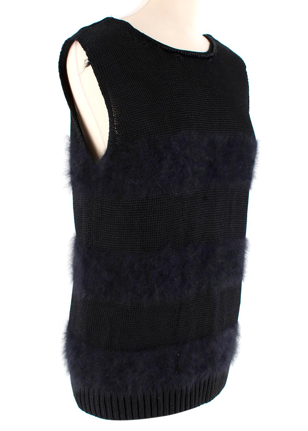 Balenciaga Black Angora Blend Knit Vest 

- Made of soft angora blend 
- Striped textured effect 
- Classic cut 
- V shaped neckline 
- Neutral black hue 
- Timeless versatile design 

Materials:
64% rayon, 25% angora, 9% polyamide, 2% lycra

Dry