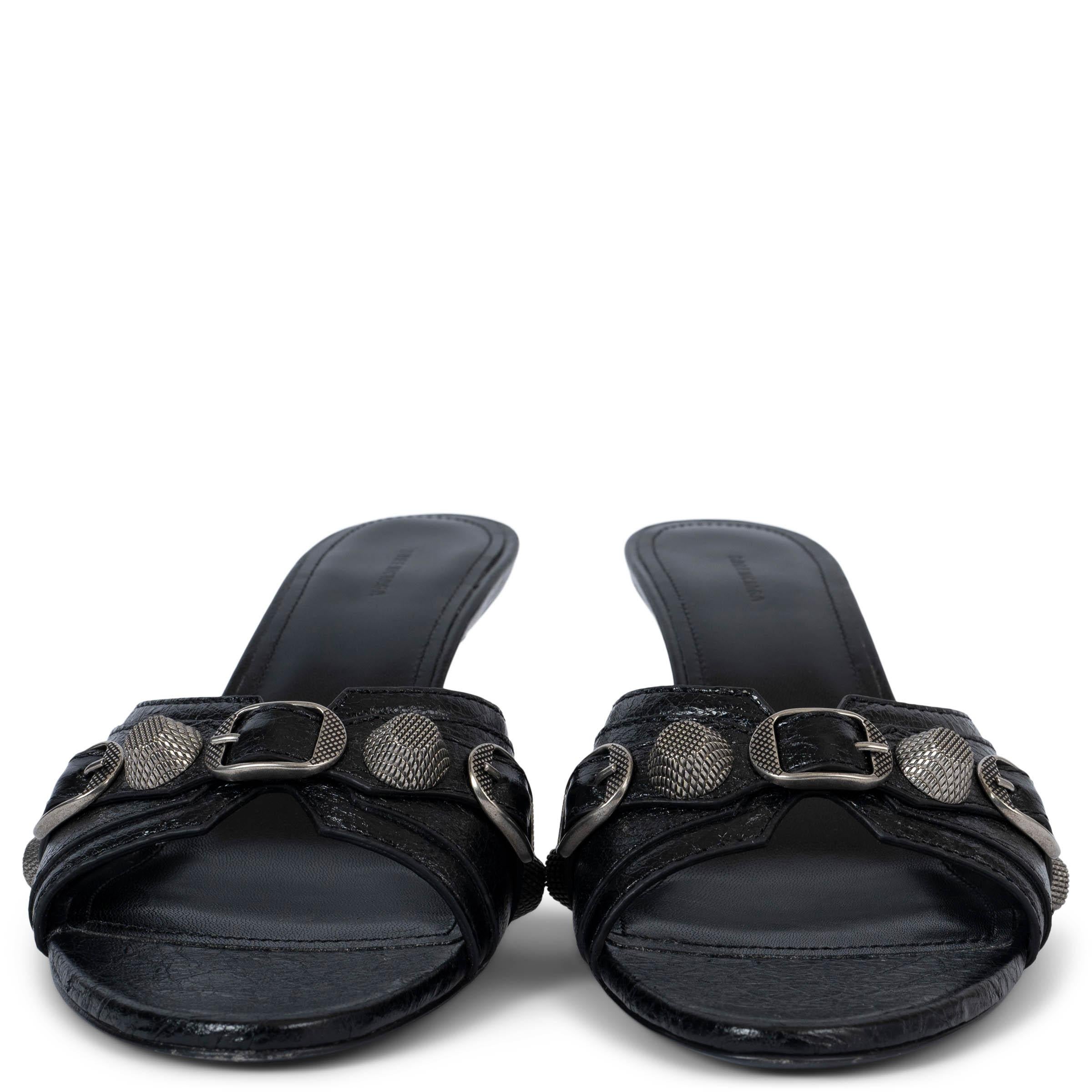 100% authentic Balenciaga Cagole 70 mules in black Arena lambskin featuring aged-silver studs and buckles on the upper. Have been worn once or twice and are in excellent condition. 

Measurements
Imprinted Size	38
Shoe Size	39
Inside Sole	26cm