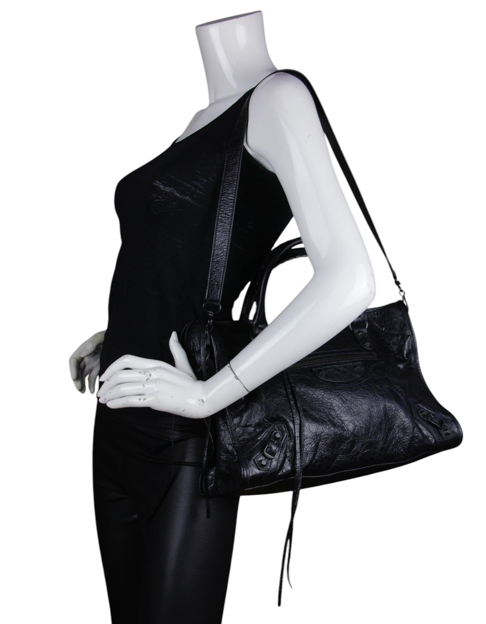 Balenciaga Black Arena Storico Lambskin Leather Medium Le City Bag with Brass Hardware

Made In: Italy
Color: Black
Hardware: Brass  
Materials: Lambskin leather
Lining: Black fine textile
Closure/Opening: Zip top
Exterior Pockets: One zip