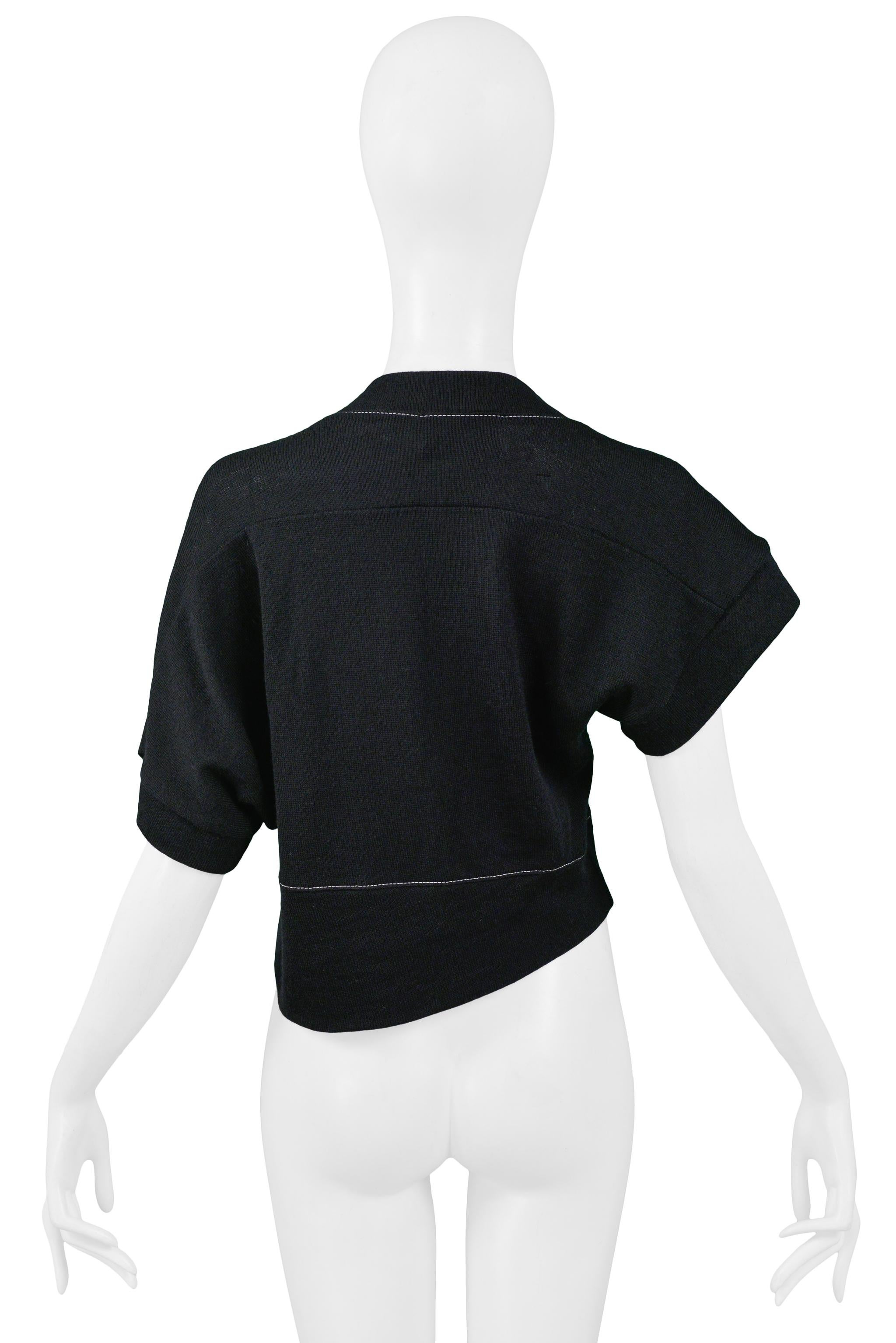 black sweater with white stitching