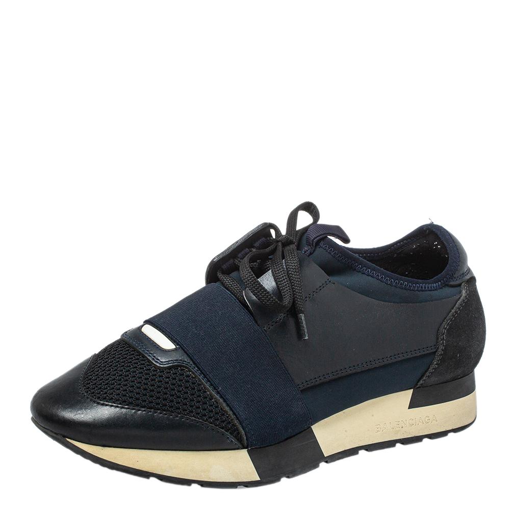 Let your latest shoe addition be this pair of Race Runners sneakers from Balenciaga. These sneakers have been crafted from a blend of quality materials and feature a chic silhouette. They flaunt covered toes, strap detailing on the vamps, and tie-up