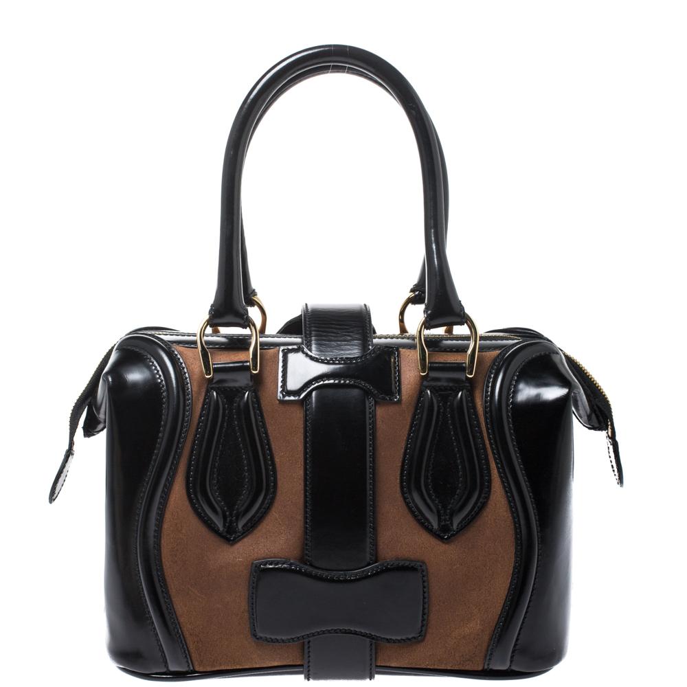 Balenciaga Black/Brown Patent Leather and Suede Sac Superb Bag
Balenciaga's Sac Superb is one unique design! Fine contours, smooth cuts and trims, practical size and utmost durability define the bag. This one here is crafted from black patent