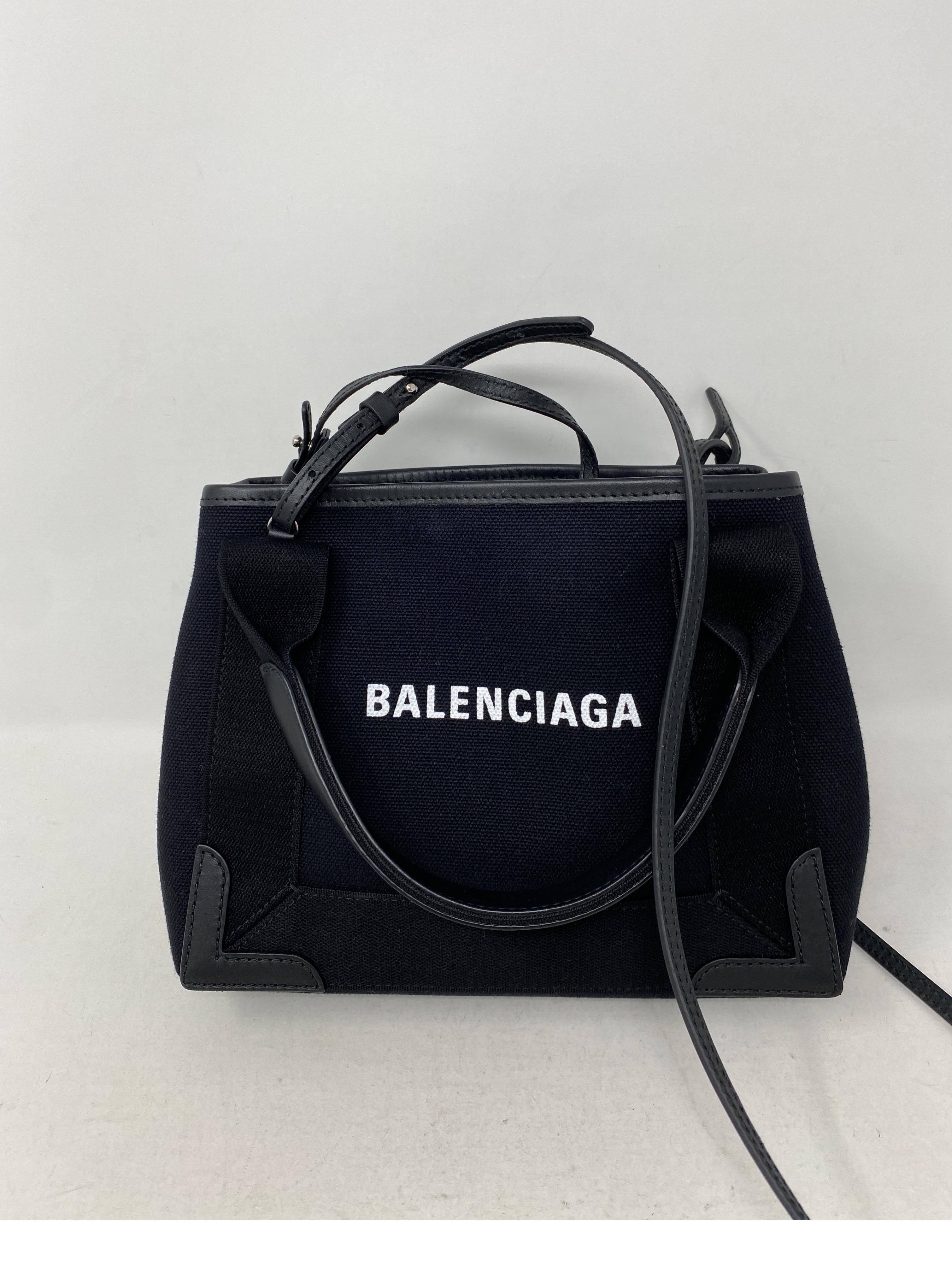 Balenciaga Black Canvas Cotton Bag. Can be worn as a crossbody too. Cute small size bag. Mint like brand new condition. Includes pouch inside. Guaranteed authentic. 