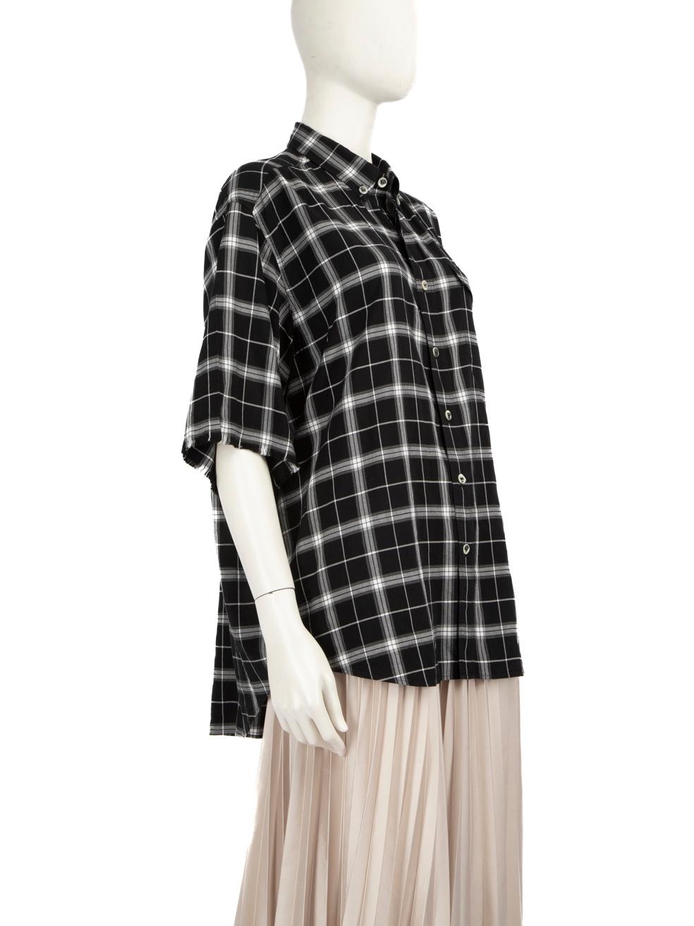CONDITION is Very Good. Hardly any visible wear to shirt is evident on this used Balenciaga designer resale item. Please note that the original sizing is men's.



Details


Unisex

Black

Viscose

Shirt

Checkered pattern

Mid length