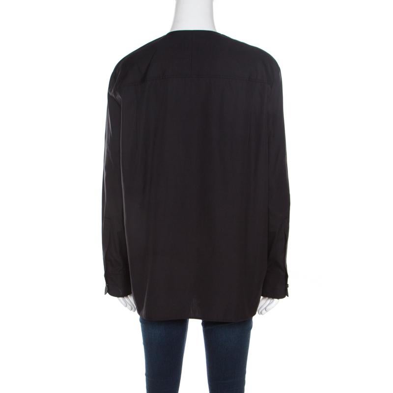 This blouse from the house of Balenciaga is an example of minimalist designing. This unique black piece will look uber chic when paired with your favorite pair of jeans. Tailored from cotton, this blouse is a must-have in every fashionista's
