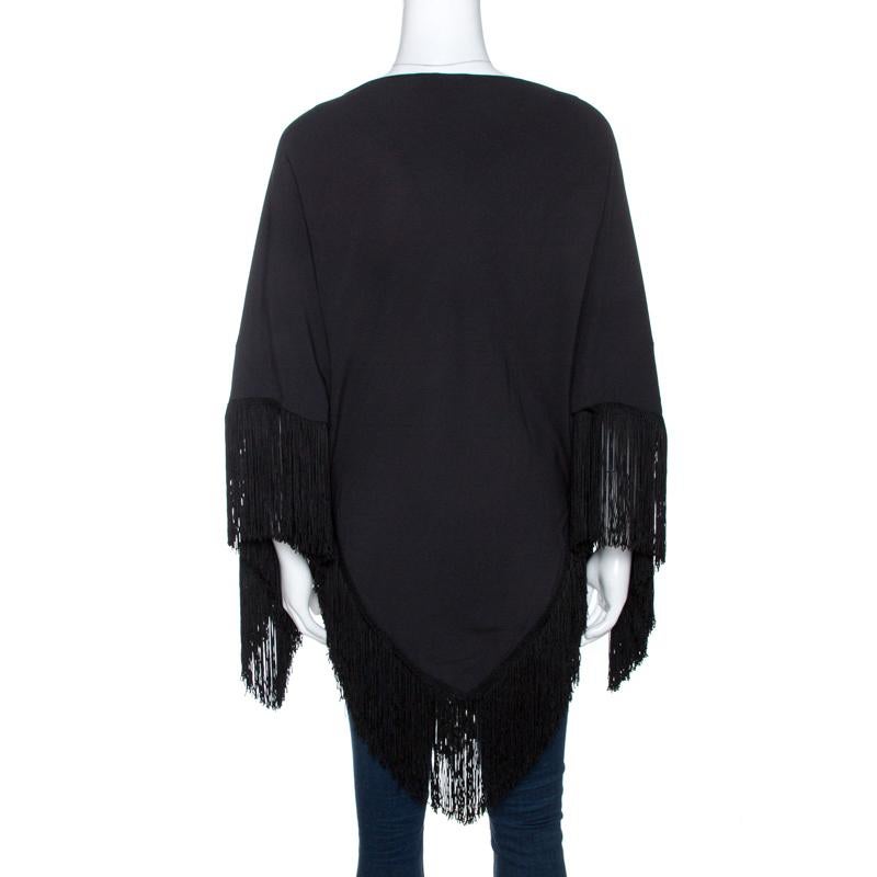 Feel warm and stylish when you wear this poncho from Balenciaga. It has been wonderfully made from quality fabrics and styled with fringes on the hemline. You'll look lovely when you assemble this creation over your fitted clothes.

