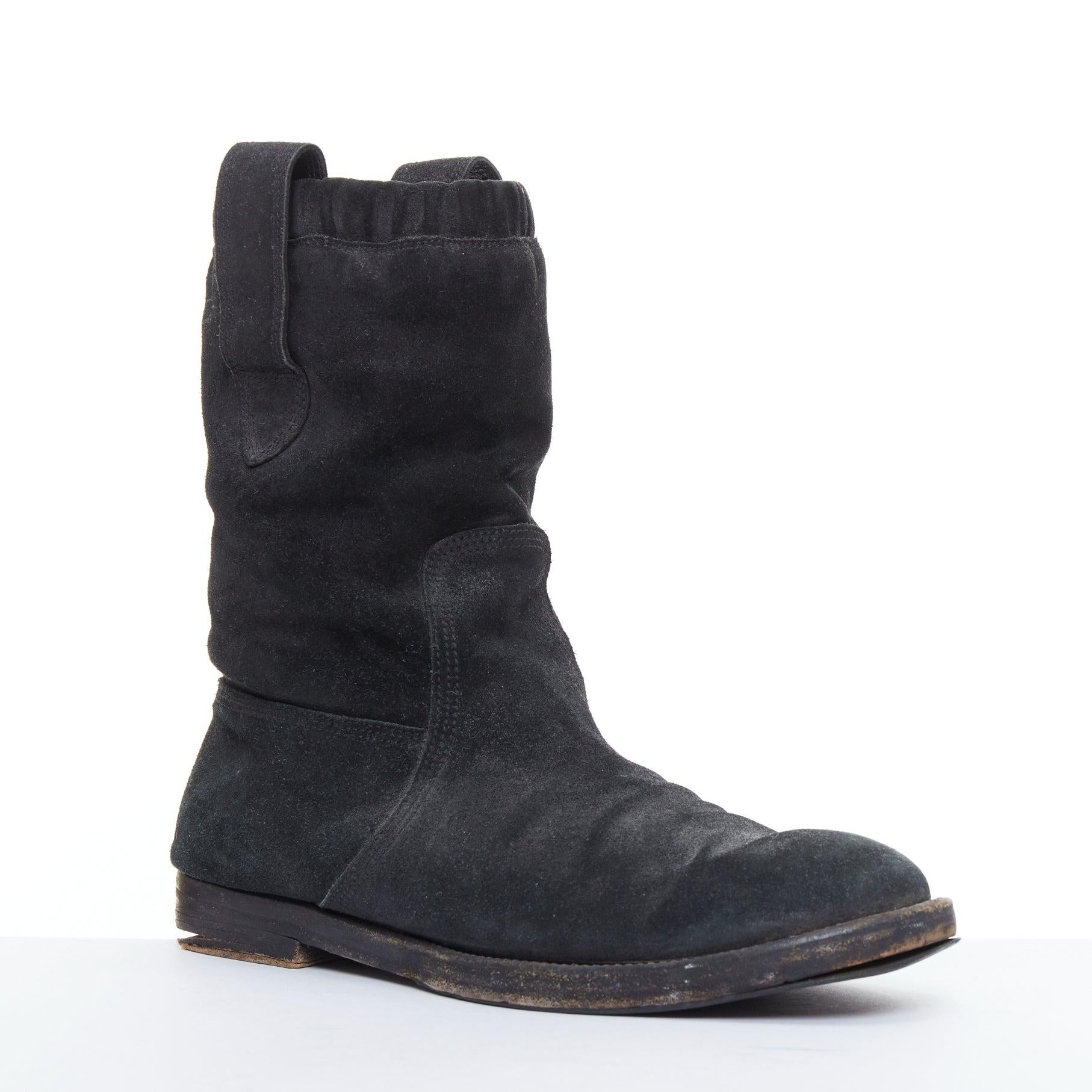 BALENCIAGA black distressed suede leather elastic flat boots
Reference: PRWU/A00119
Brand: Balenciaga
Designer: Nicolas Ghesquiere
Material: Leather
Color: Black
Pattern: Solid
Closure: Elasticated
Lining: Black Leather

CONDITION:
Condition: Fair,