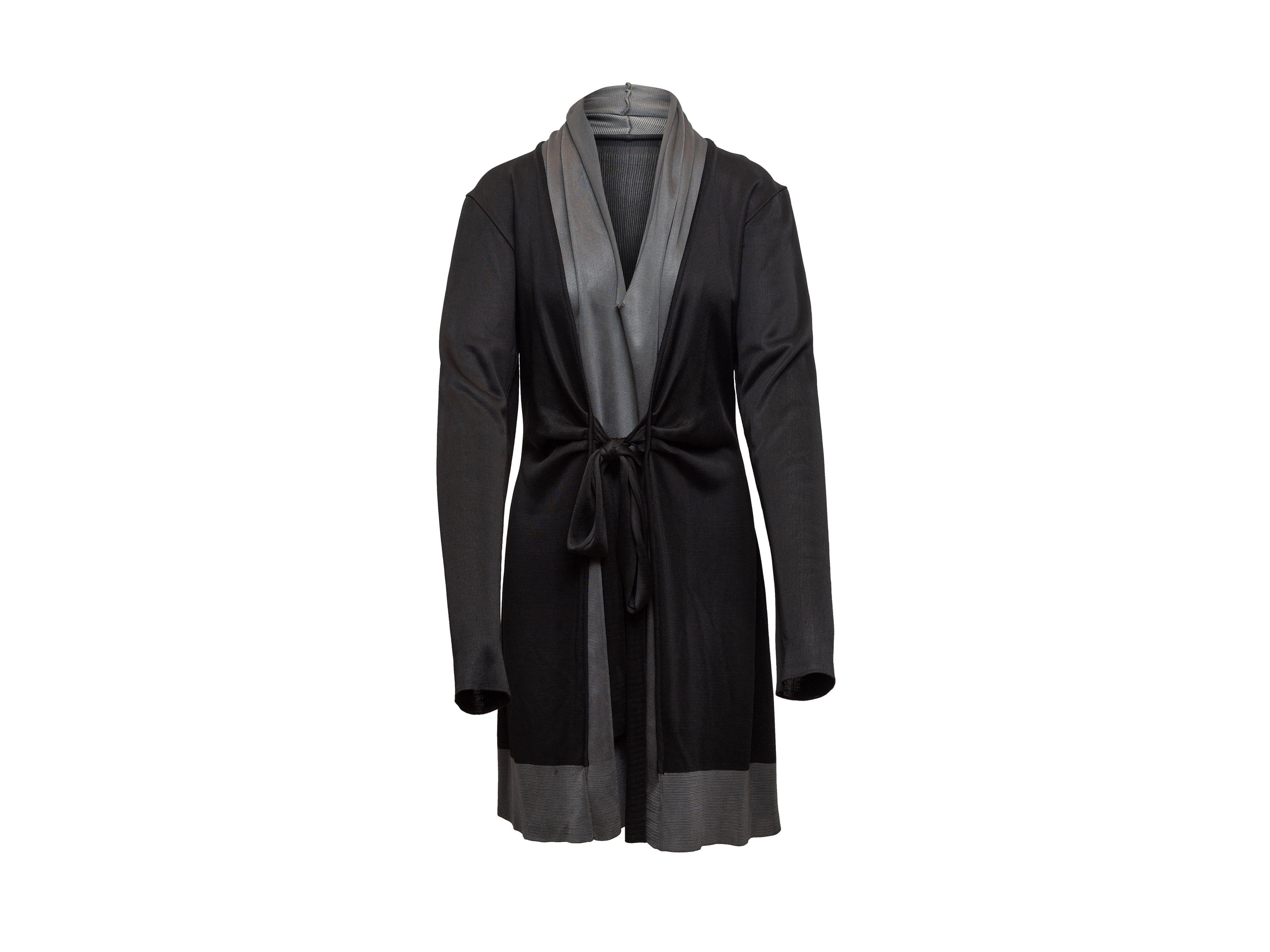 Product details: Black and grey long sleeve wrap dress by Balenciaga. Sash tie closure at front. Designer size 40. 68