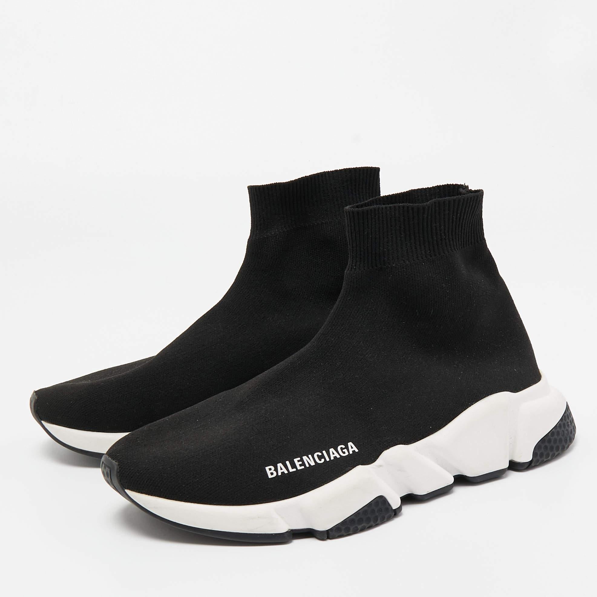 Elevate your footwear game with these Balenciaga black sneakers. Combining high-end aesthetics and unmatched comfort, these sneakers are a symbol of modern luxury and impeccable taste.

