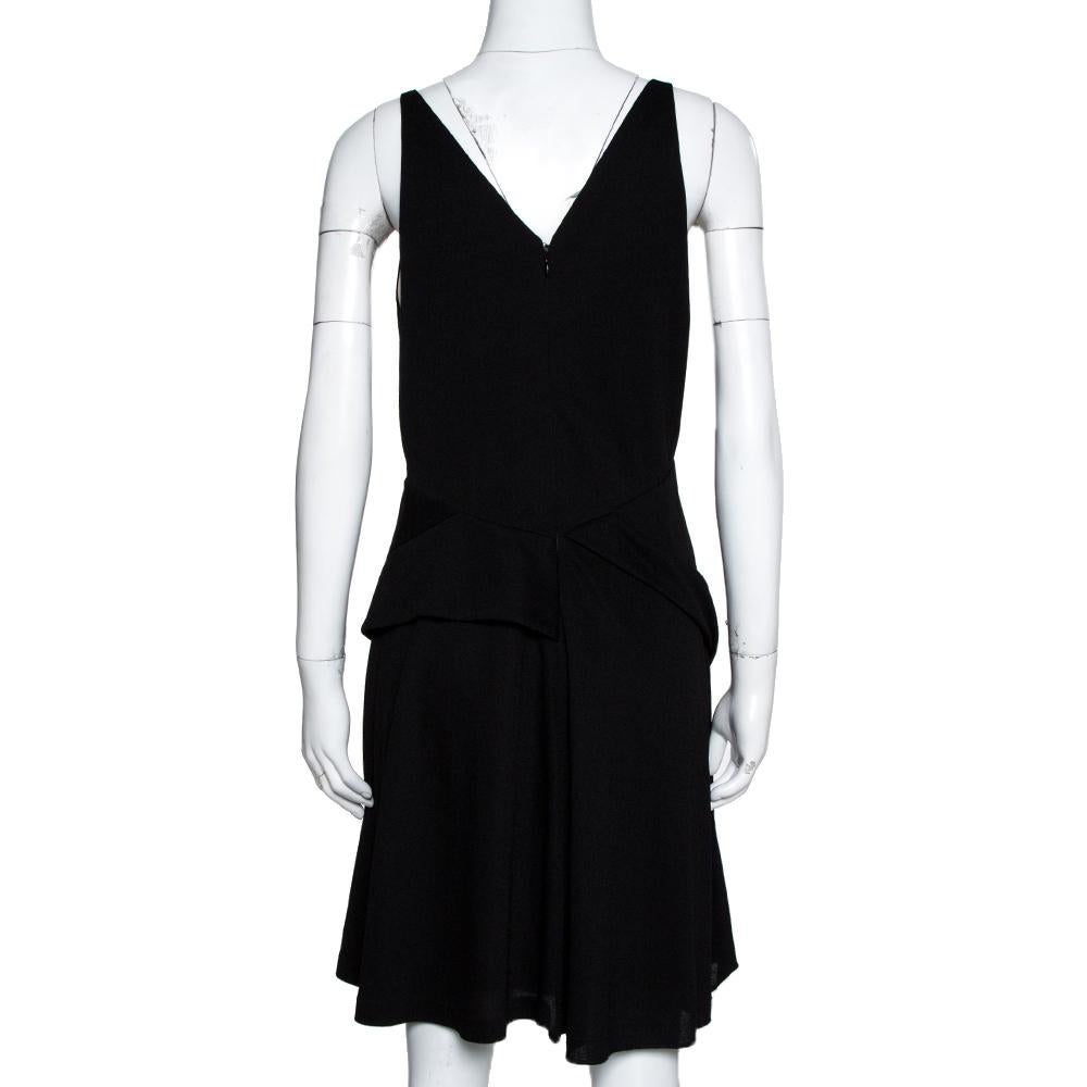 Get admired for your amazing style when you sport this ensemble from the house of Balenciaga. For a luxurious touch, accessorize this black knit dress with gold-tone jewelry. Flaunt your best look when you don this sleeveless dress. It has a zip