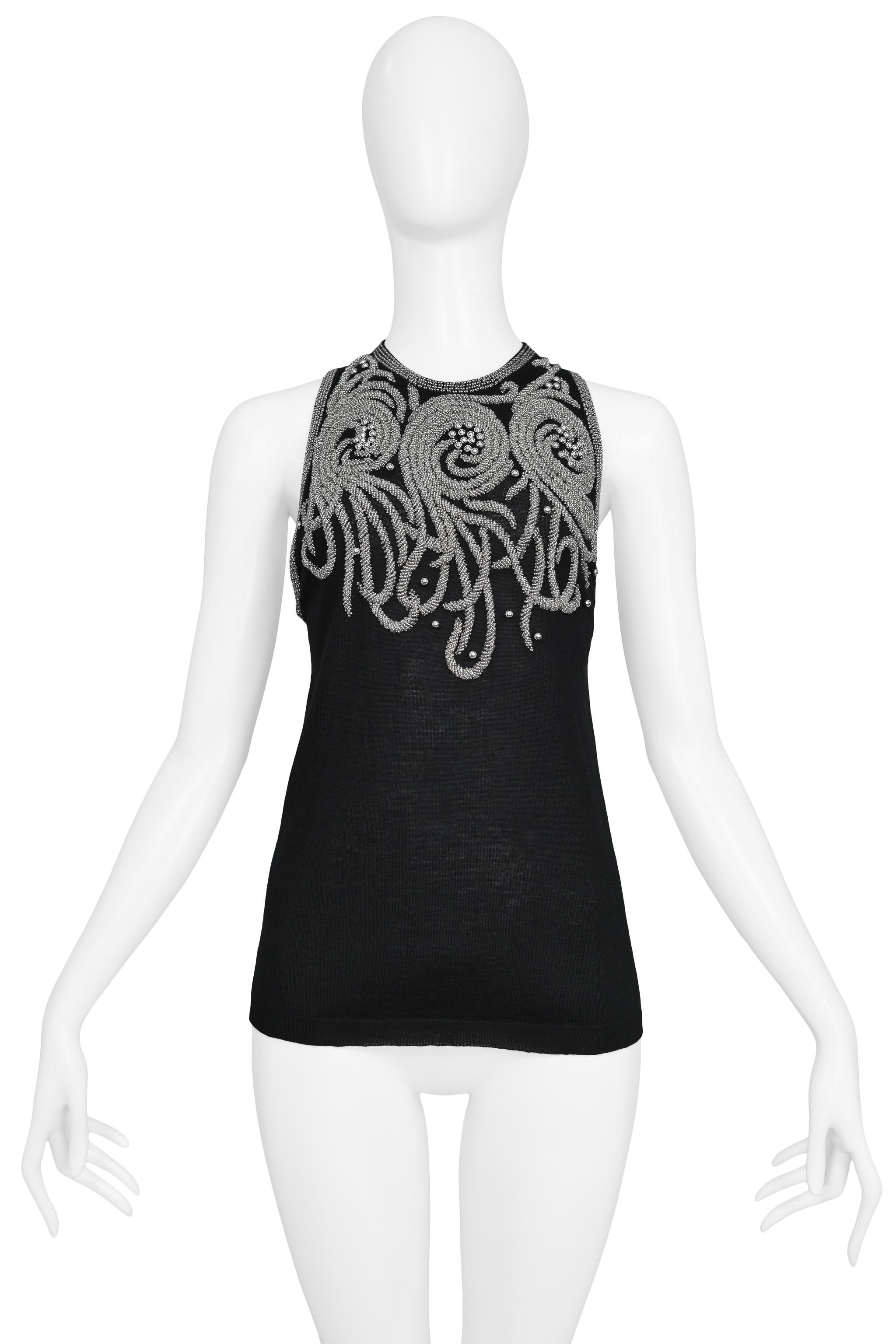 Vintage Balenciaga by Nicolas Ghesquiere black knit tank sweater featuring sleeveless body, silver beading, and keyhole back. 

Balenciaga Label
Designed By Nicolas Ghesquiere
Size 40
Knit
Excellent Vintage Condition
Authenticity Guaranteed 