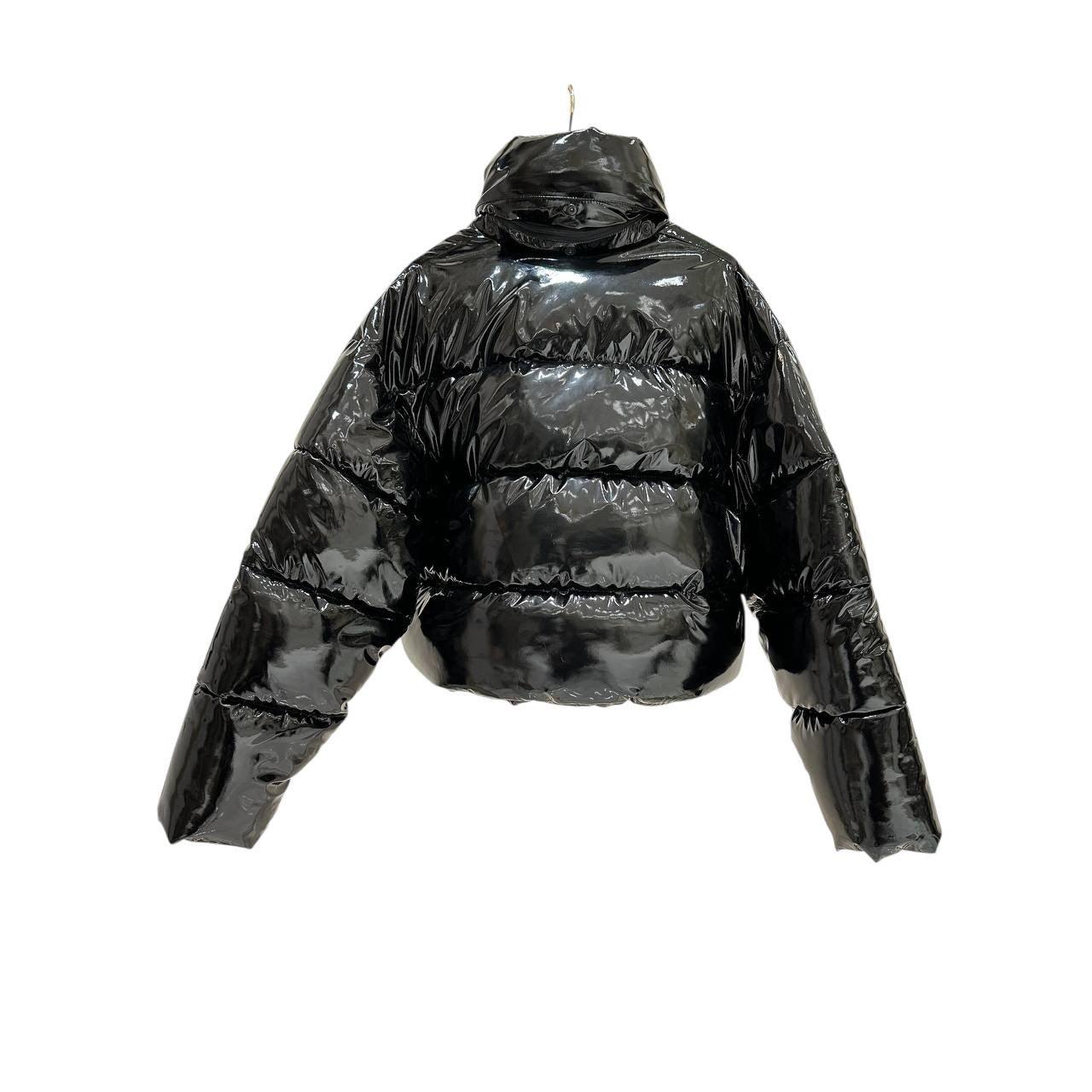 Upgrade your wardrobe with this chic Balenciaga black lacquered puffer jacket! This stylish piece is perfect for adding a touch of luxury to any outfit. 

Size: 38

Condition: Good. Please see photos for a small spot.

Note: Hanger not