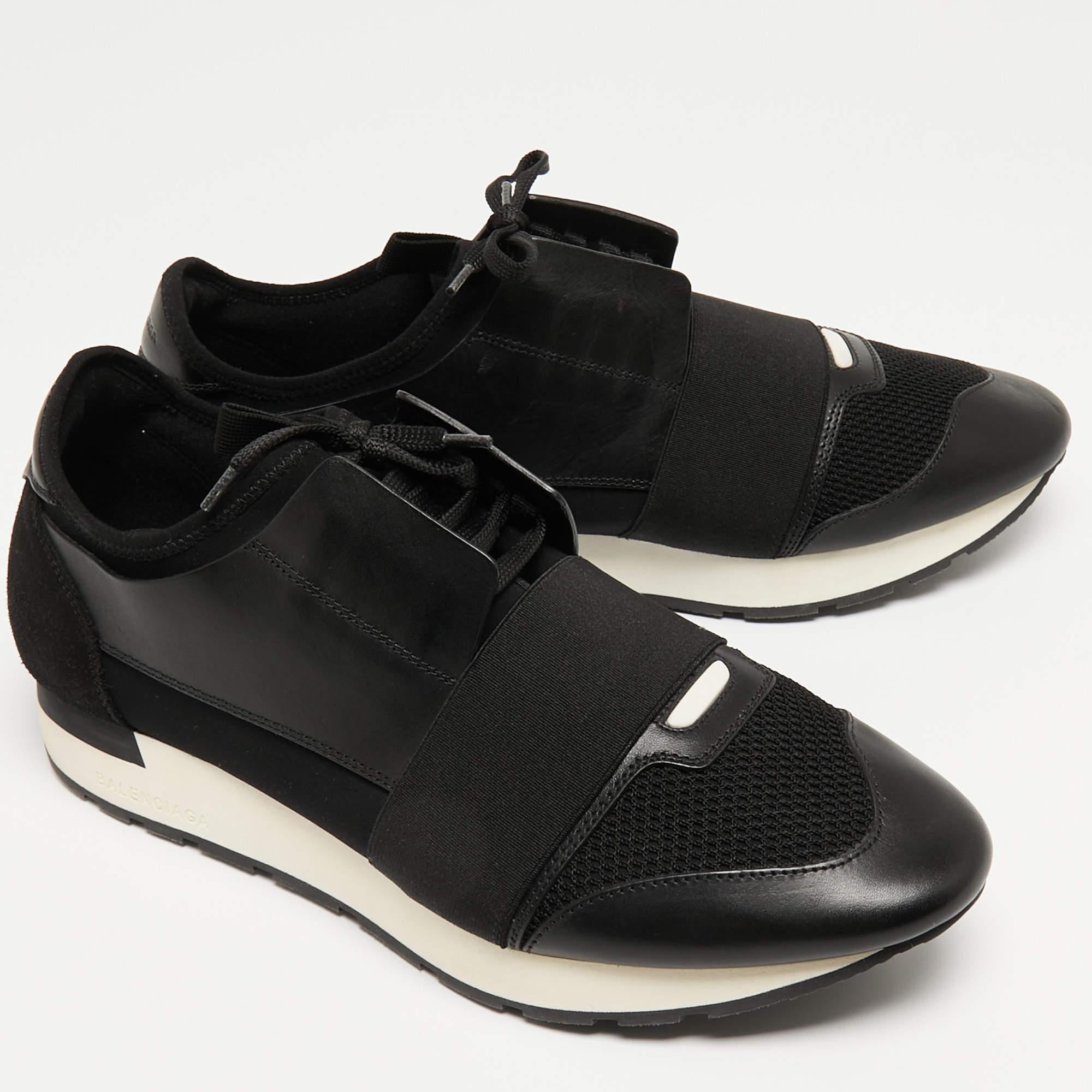 Let your latest shoe addition be this pair of Race Runners sneakers from Balenciaga. These black sneakers have been crafted from leather and fabric and feature a chic silhouette. They flaunt covered toes, strap detailing on the vamps, and tie-up
