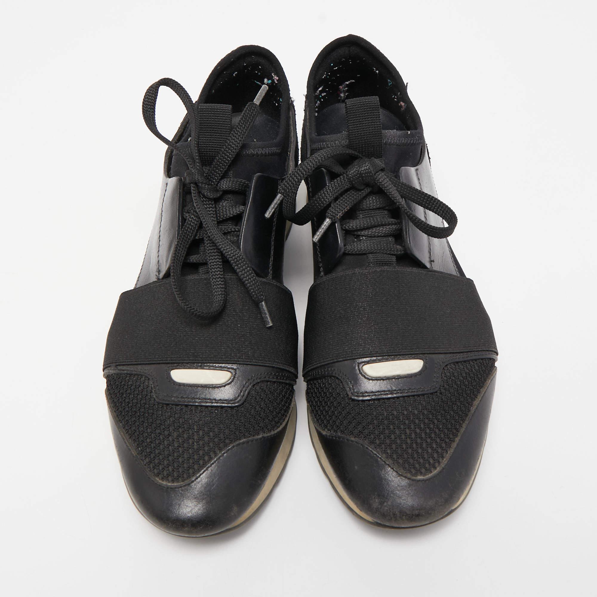 Let your latest addition be this pair of Race Runners sneakers from Balenciaga. Its exterior is crafted using black leather as well as mesh with covered toes, strap detailing on the vamps, and lace-up fastenings. This pair is completed with a