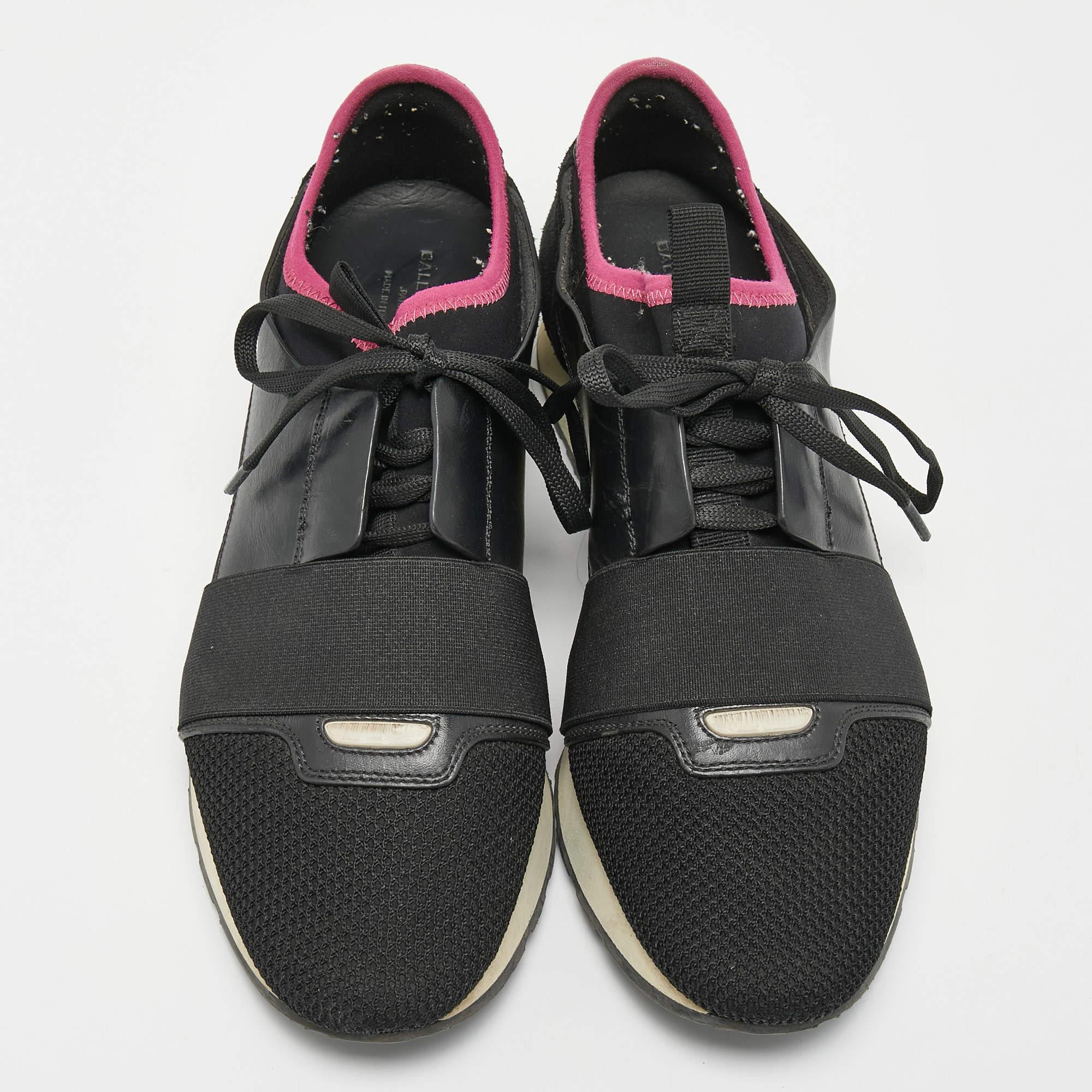 The Balenciaga Race Runner sneakers have been crafted from quality materials and feature a chic silhouette. They flaunt covered toes, strap detailing on the vamps, and tie-up fastenings. They are complete with a leather-lined insole and a tough base