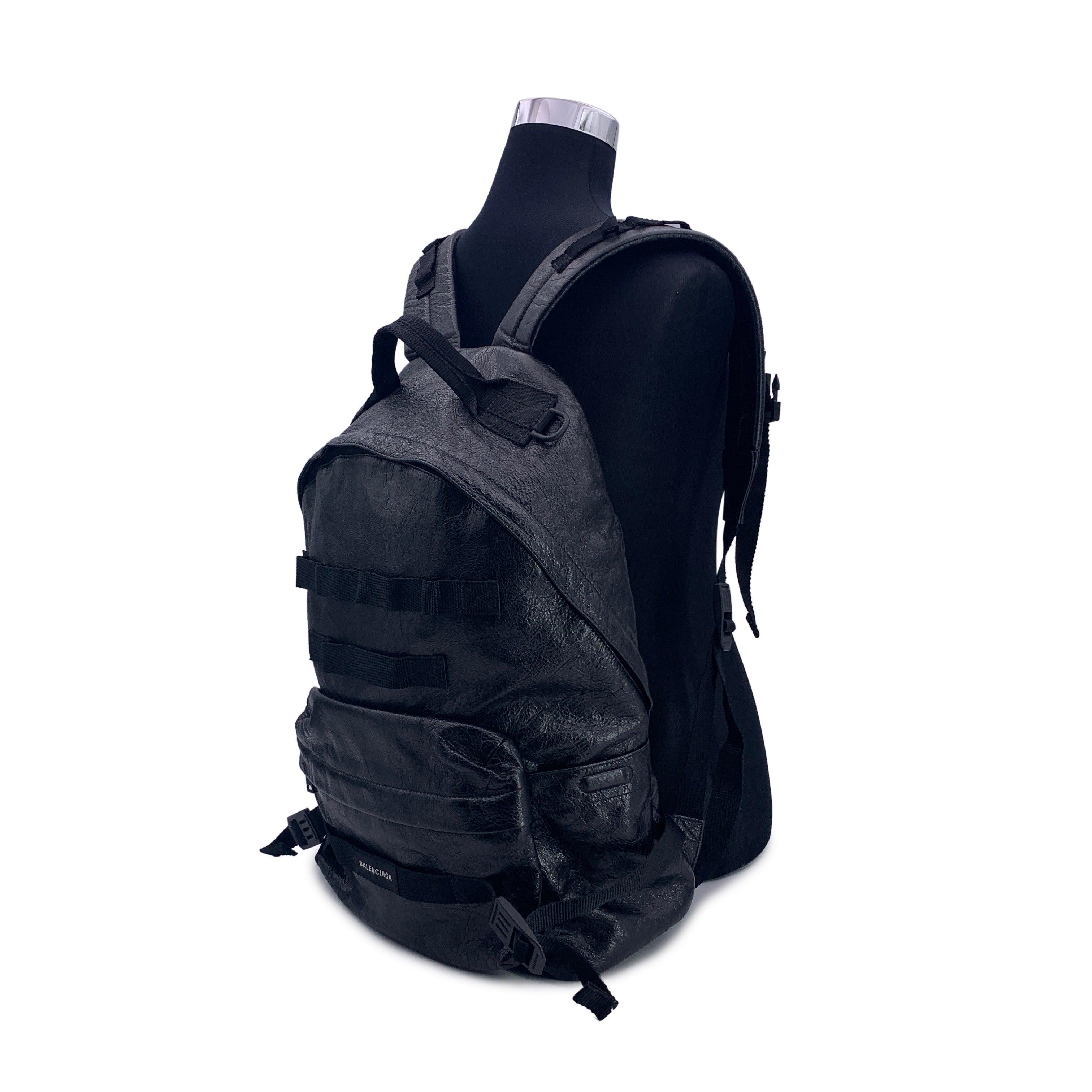 This beautiful Bag will come with a Certificate of Authenticity provided by Entrupy. The certificate will be provided at no further cost Balenciaga black Arena leather Army miltary Backpack bag. It features 1 top handle, adjustable shoulder straps,