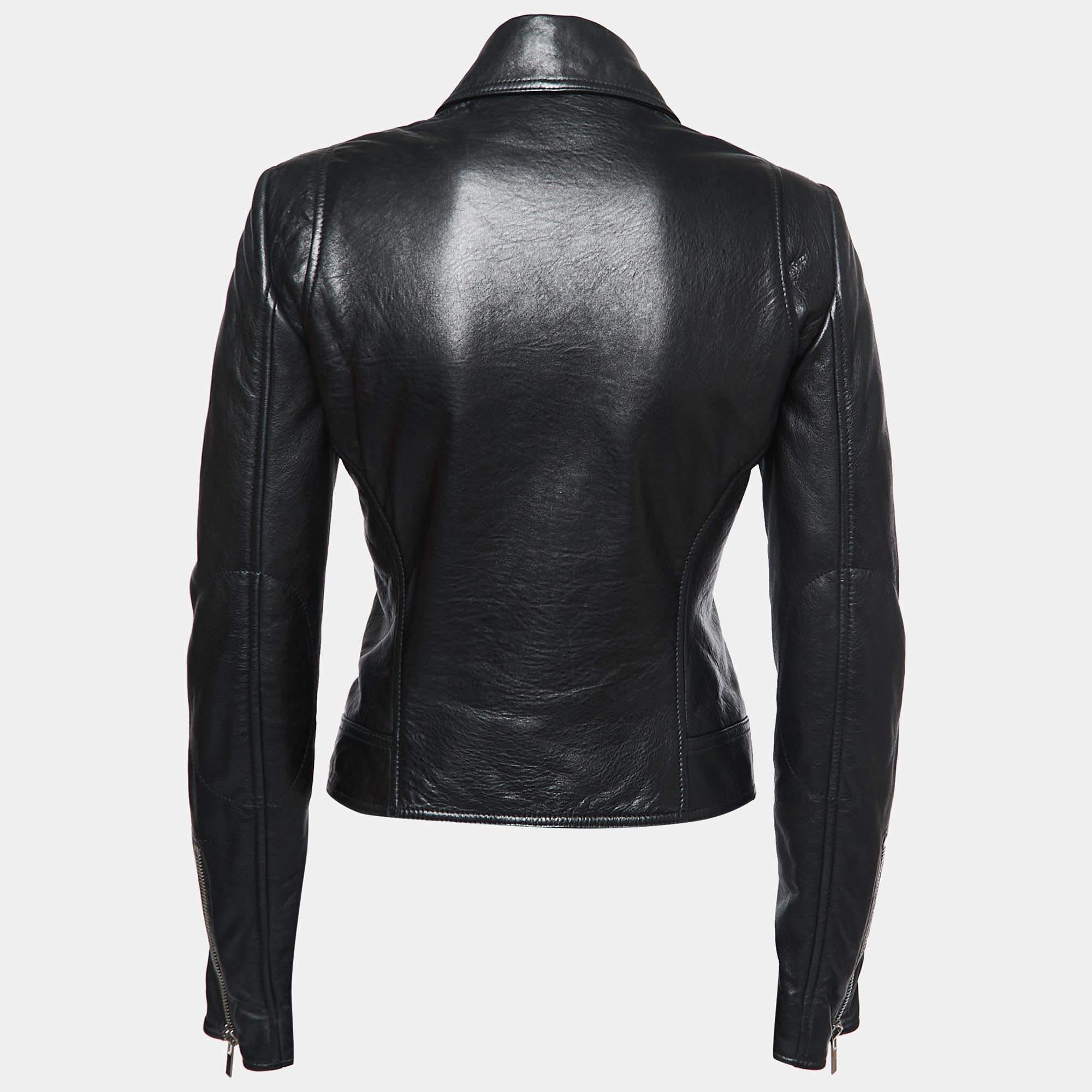 Smart, sturdy, and stylish, this Biker jacket from the House of Balenciaga will add a trendy touch to all your sporty looks! It is designed from black leather. It flaunts a zip-front feature, long sleeves, and two pockets. Wear this stunning