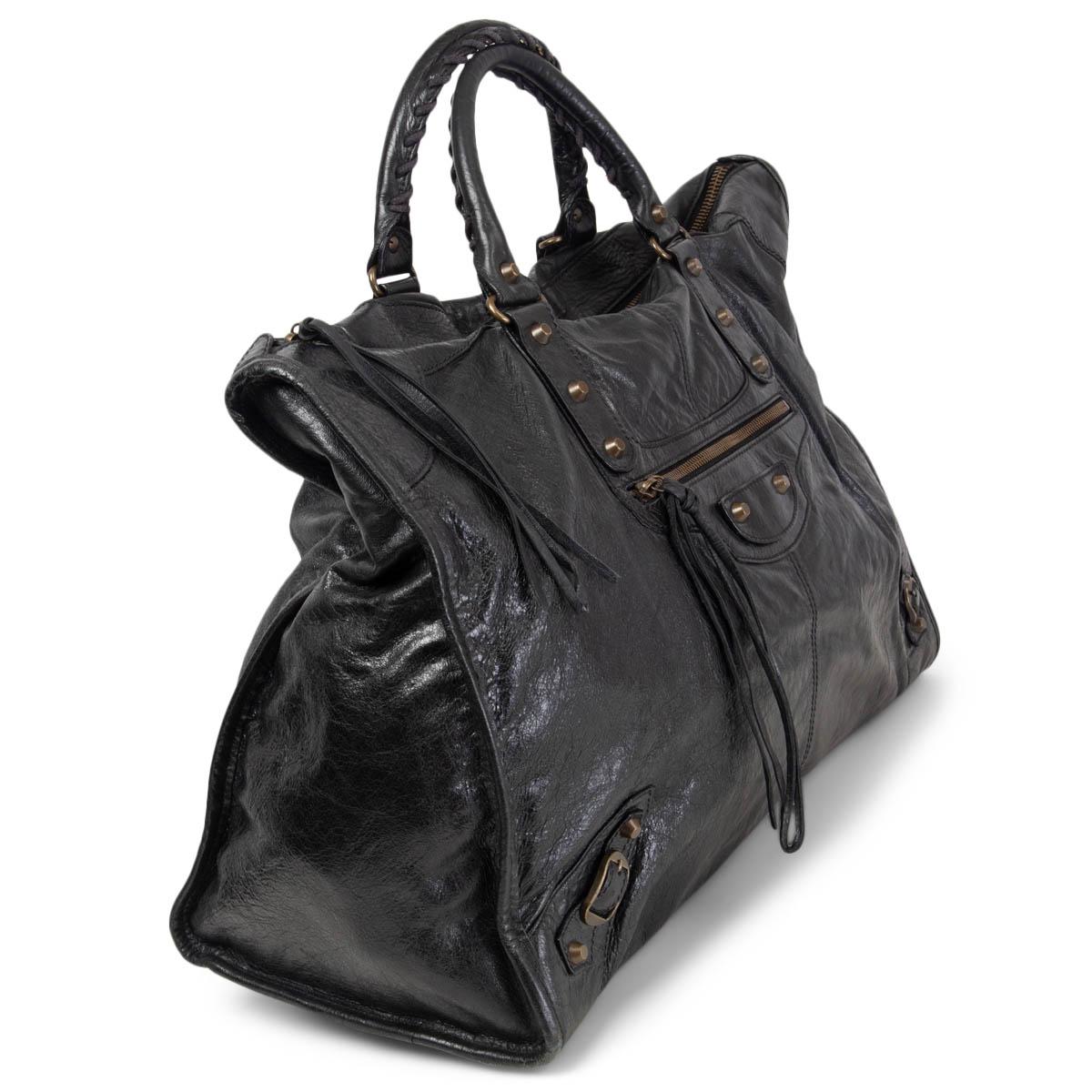 100% authentic Balenciaga Large Motocross Classic City Tote Handbag in black soft distressed calfskin and gunmetal hardware. Opens with zipper on top and is lined in black canvas with one zip pocket against the back. Designed with an exterior front