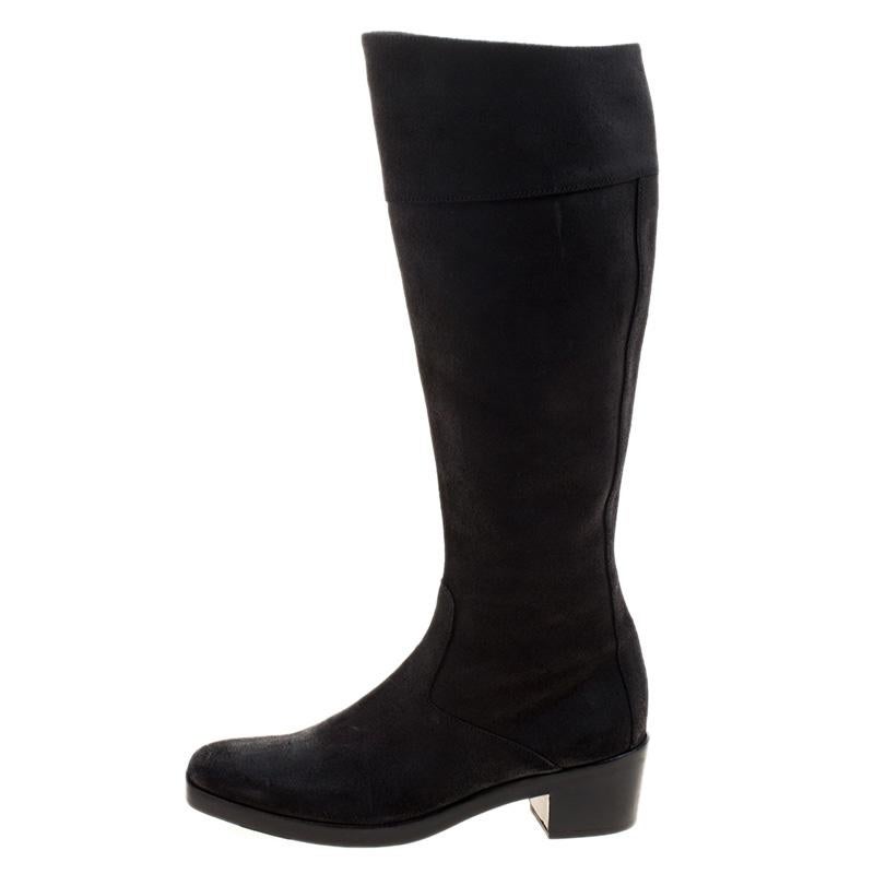 Here's a pair that brings comfort packed in a chic avatar. These knee-high boots from Balenciaga fitted with low height block heels and enhanced with a silver-toned zipper at the back for ease of wear ensure that evening strolls during winter are as