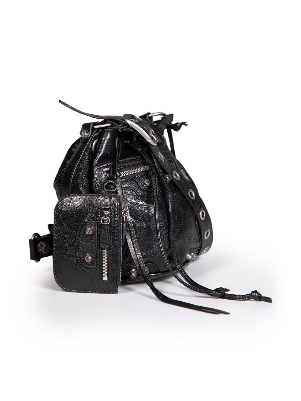 CONDITION is Very good. Hardly any visible wear to bag is evident on this used Balenciaga designer resale item.
 
 
 
 Details
 
 
 Model: Le Cagole
 
 Black
 
 Leather
 
 Mini crossbody bucket bag
 
 Silver tone hardware
 
 Eyelets detail
 
