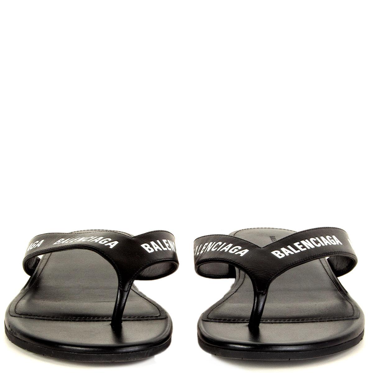 100% authentic Balenciaga allover logo round thong sandals in black and white printed calfskin. They feature a rubber sole. Have been worn and are in excellent condition. 

Measurements
Imprinted Size	37
Shoe Size	37
Inside Sole	24.5cm