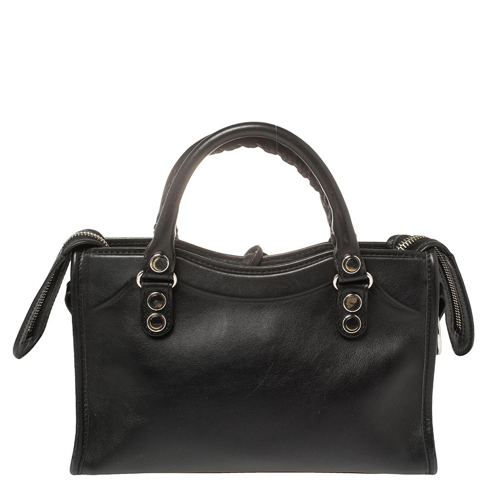 Balenciaga is known for their finely made products and the City bags are one of them. Effortless and stylish, this leather bag will be your go-to for multiple occasions. It has silver-tone stud details and a front zipper. Two top handles, a shoulder