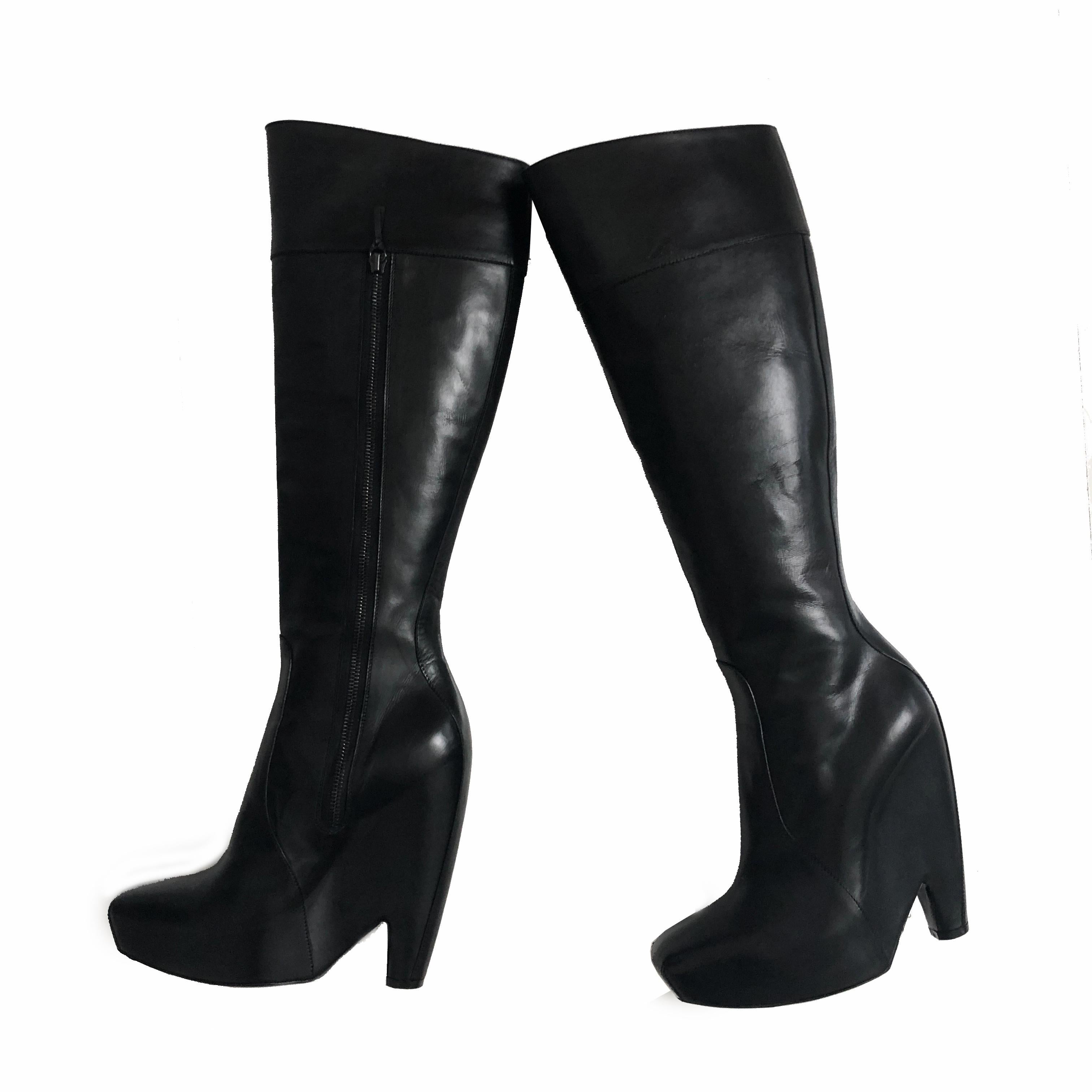 Balenciaga by Nicolas Ghesquière black leather platform boots, from the F/W 2006 collection.  Tagged size 39, they measure: shaft - 17in (front), shaft - 15in (back), Heel height - appx 6in, inner sole length - appx 10in, width (bottom sole) -