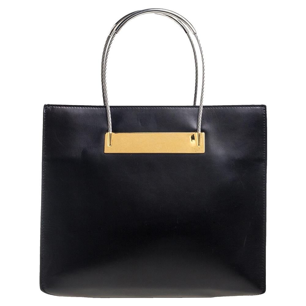 Spotted with celebrities like Rihanna, Zor Kravitz, Chrissy Teigen, and many more, Balenciaga's Cable shopper tote is one of their most popular designs. Crafted from black leather, the open-top style comes fitted with two sleek top handles, and the