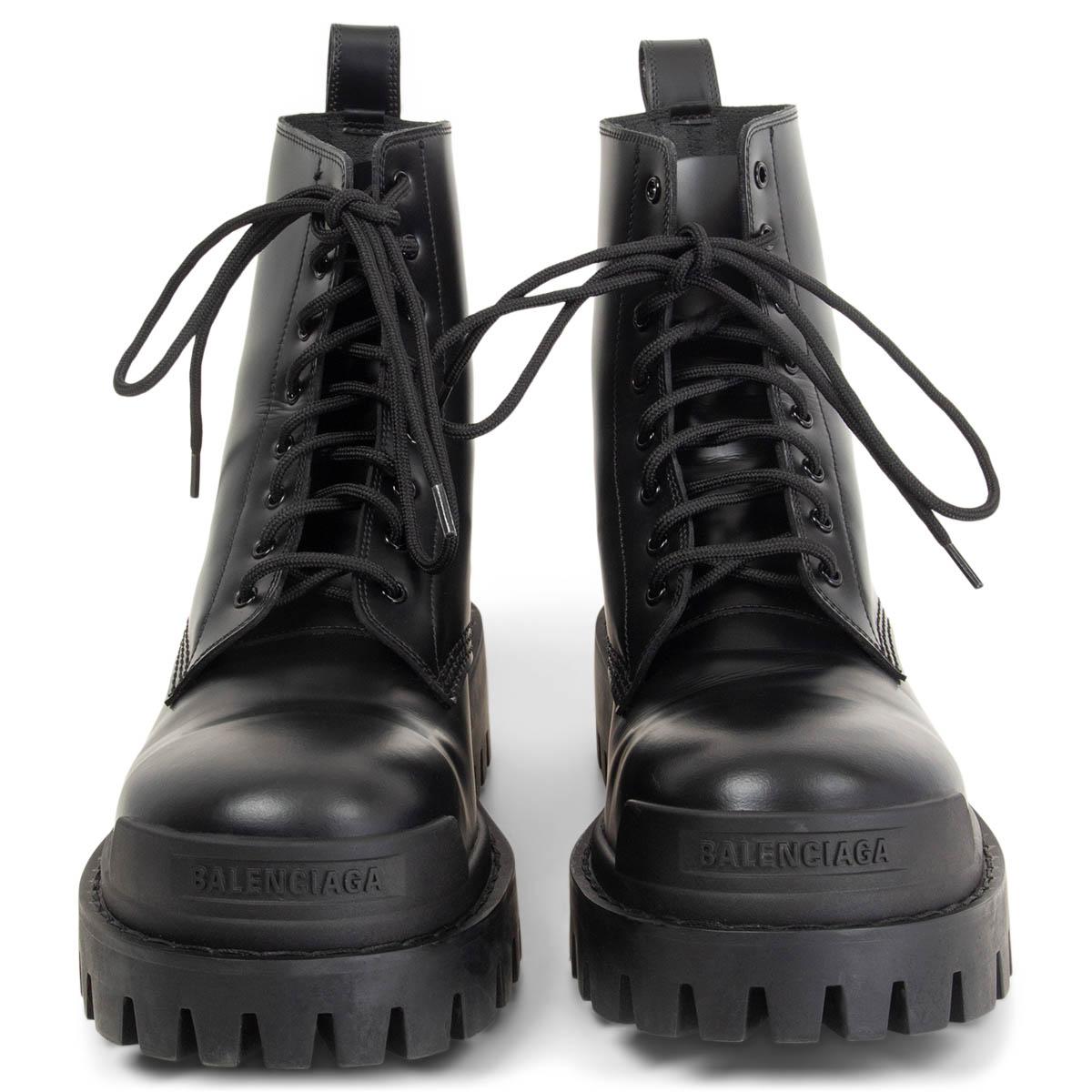 100% authentic Balenciaga lace-up Strike Combat Boots in black polished calfskin featuring a chunky rubber sole and pull tab at the back. Have been worn once and are in excellent condition. 

Measurements
Imprinted Size	38.5
Shoe Size	38.5
Inside