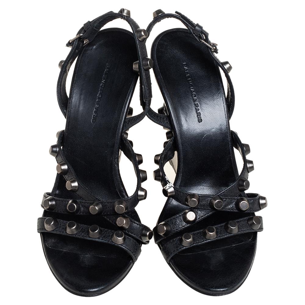 Chic and casual, these sandals are a great choice for a summer day! They are covered with black leather and accented with silver-tone studs, buckle closure on slingbacks, and leather-lined insoles. Get an instant rockstar look when you pair them