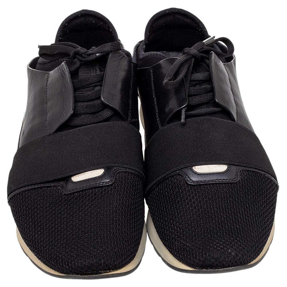 Let your latest shoe addition be this pair of Race Runners sneakers from Balenciaga. These black sneakers have been crafted from suede, leather, and mesh and feature a smart silhouette. They flaunt covered toes, strap detailing on the vamps, and