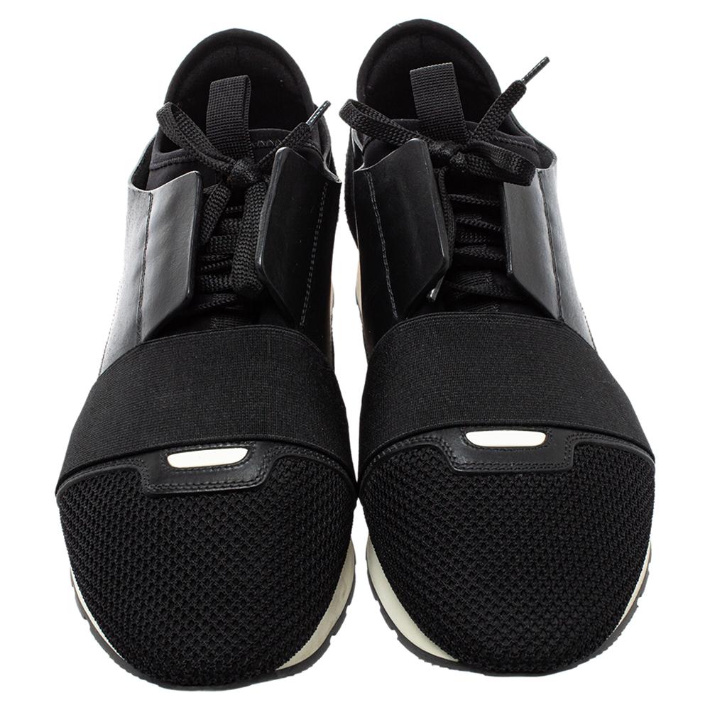 Let your latest shoe addition be this pair of Race Runner sneakers from Balenciaga. These black sneakers have been crafted from mesh, suede, and leather and feature a chic silhouette. They flaunt-covered toes, strap detailing on the vamps, and