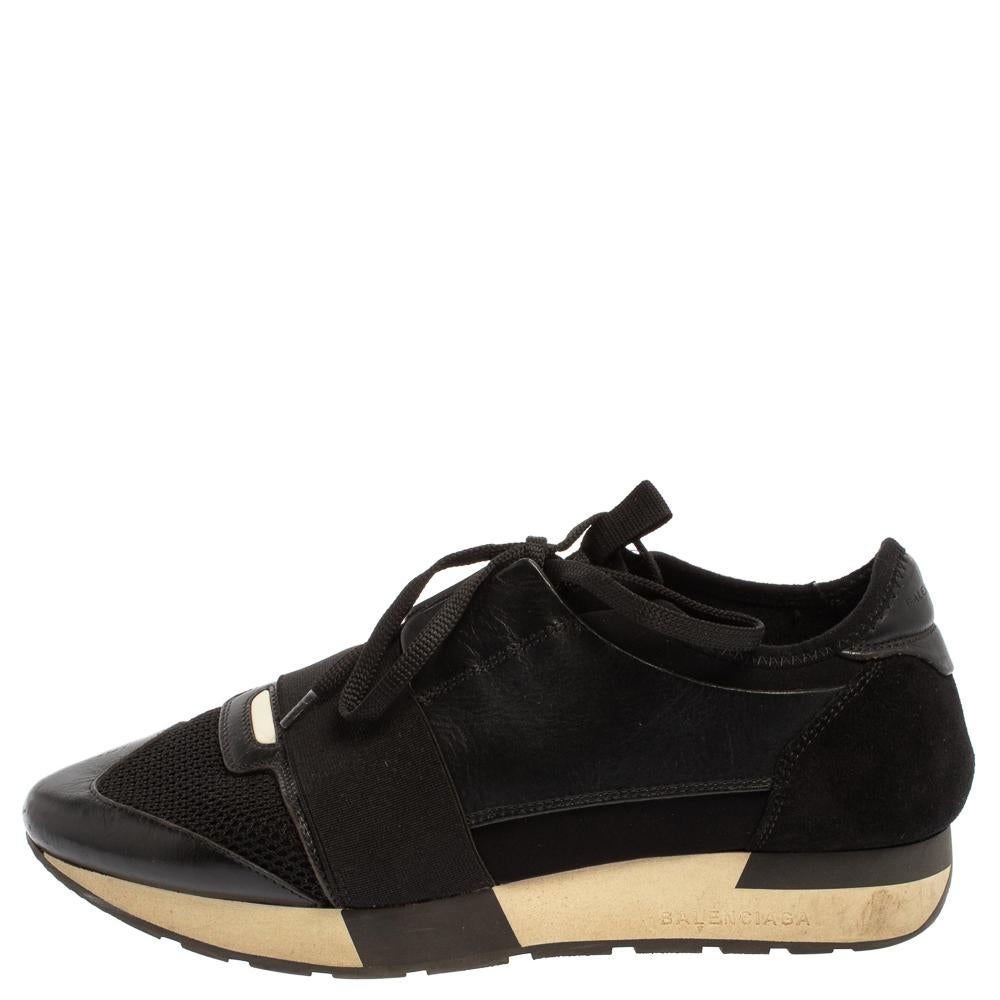 Let your latest shoe addition be this pair of Race Runners sneakers from Balenciaga. These black sneakers have been crafted from suede, leather, and mesh and feature a chic silhouette. They flaunt covered toes, strap detailing on the vamps, and