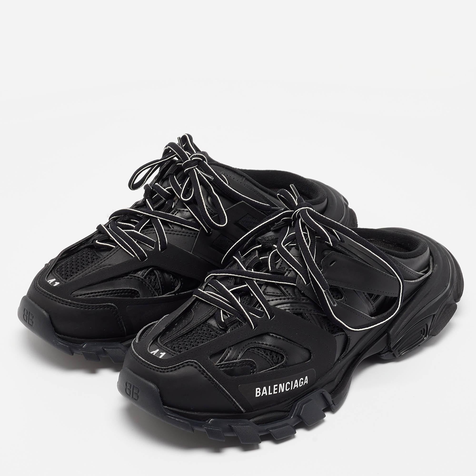 The Balenciaga Mule Sneakers redefine contemporary footwear with a bold yet practical design. Crafted from durable black mesh and complemented by rugged, non-slip rubber soles, these mules blend the breathability and comfort of a sneaker with the
