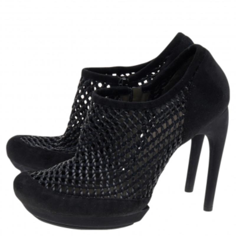 There are some shoes that stand the test of time and fashion cycles, these timeless Balenciaga ankle booties are the one. Crafted from leather in a black shade, they are designed with sleek cuts, and round-toes.