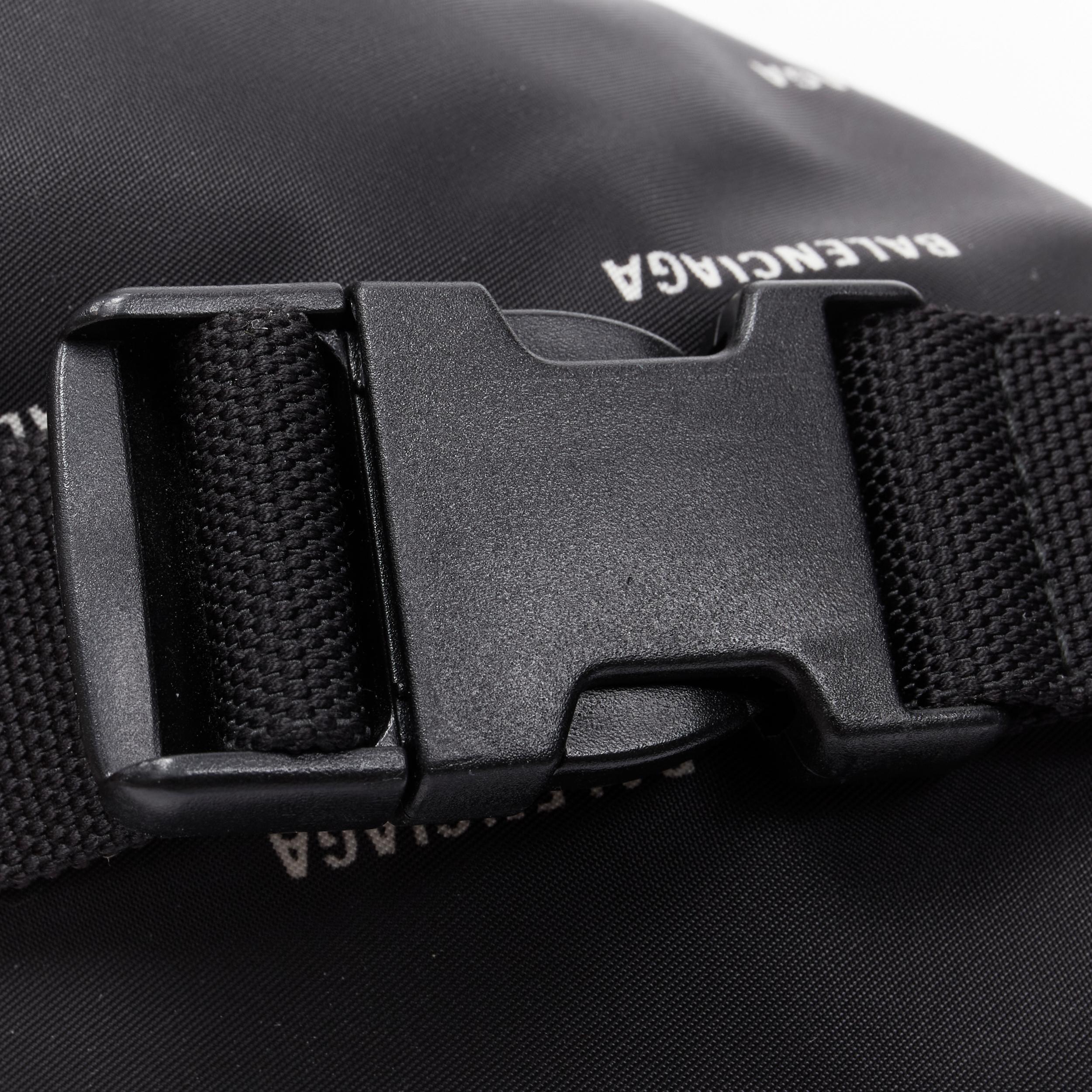 BALENCIAGA black nylon all over white logo print crossbody pouch waist bag 1