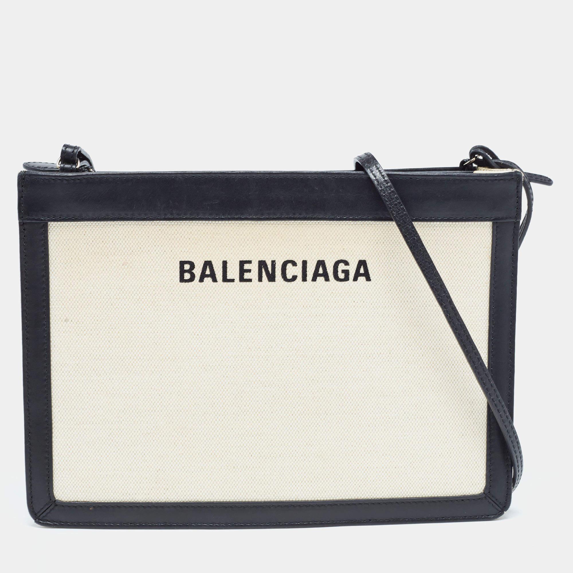 This lovely crossbody bag by Balenciaga will lend a stylish accent to your look of the day. It features a canvas & leather exterior, canvas interior, silver-tone hardware, and a shoulder strap.

