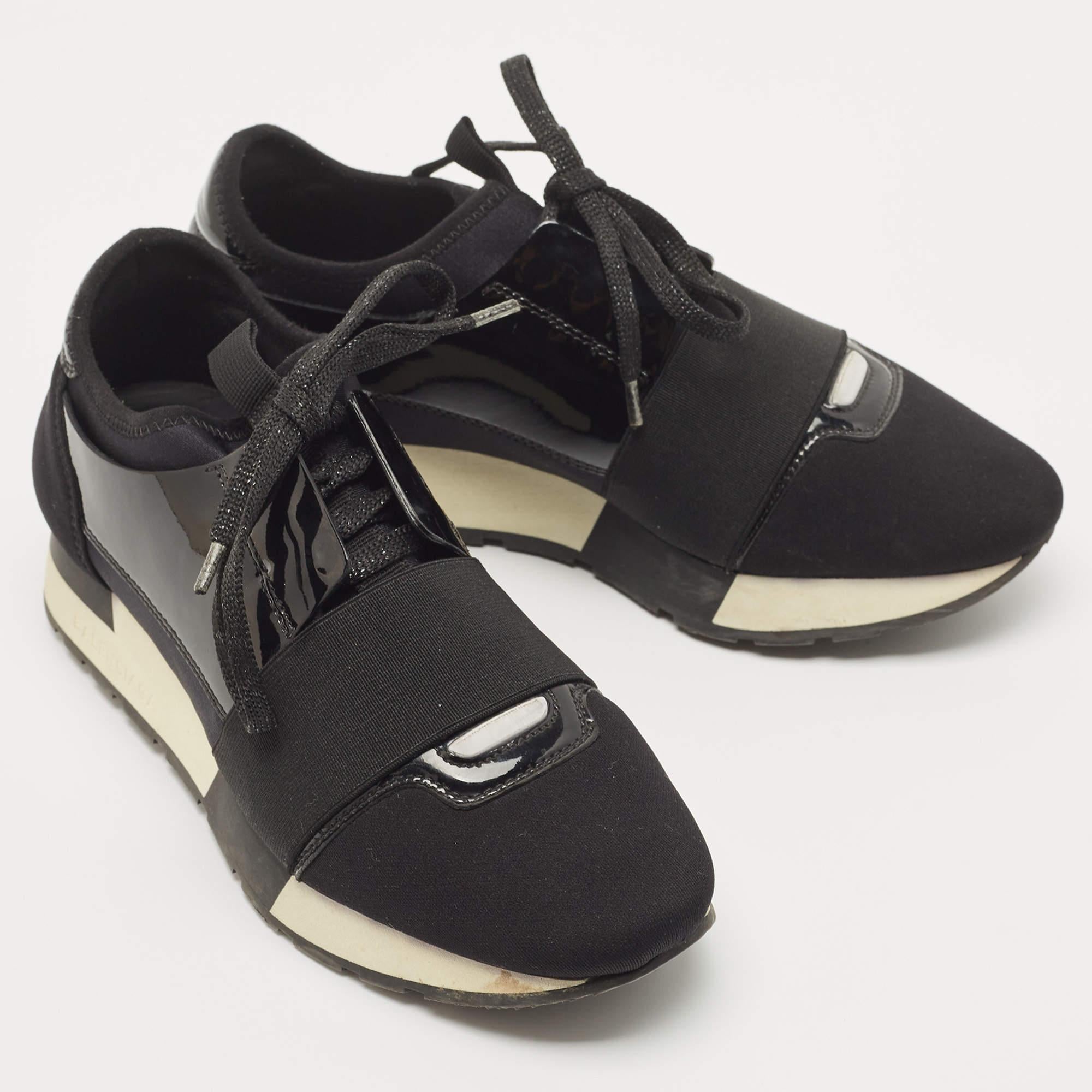 The Balenciaga Race Runner sneakers have been crafted from quality materials and feature a chic silhouette. They flaunt covered toes, strap detailing on the vamps, and tie-up fastenings. They are complete with a leather-lined insole and a tough base