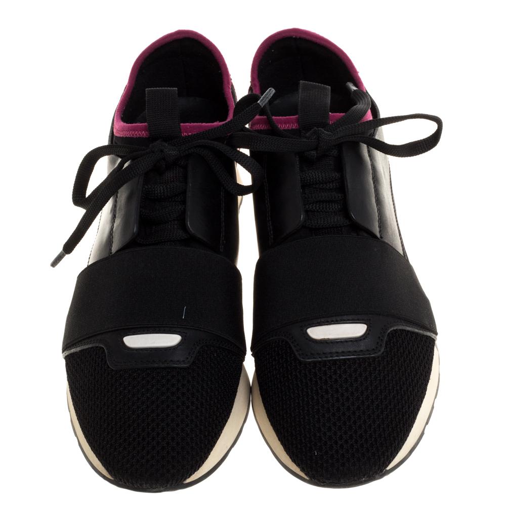 Let your latest shoe addition be this pair of Race Runners sneakers from Balenciaga. These black sneakers have been crafted from leather, suede, and mesh and feature a chic silhouette. They flaunt covered toes, fabric strap detailing on the vamps,