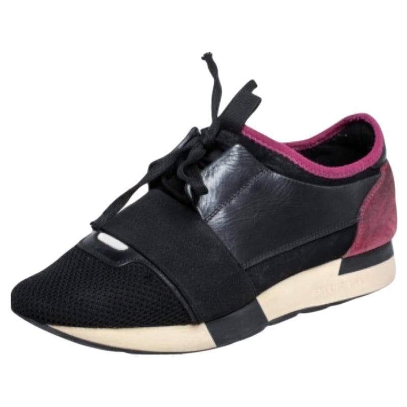 Let your latest shoe addition be this pair of Race Runner sneakers from Balenciaga. These sneakers have been crafted from quality materials and feature a chic silhouette. They flaunt covered toes, strap detailing on the vamps, and tie-up fastenings.