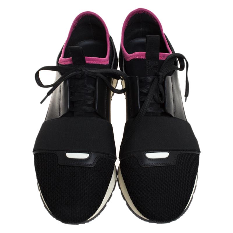 Let your latest shoe addition be this pair of Race Runners sneakers from Balenciaga. These black sneakers have been crafted from suede, leather and nylon into a chic silhouette. They flaunt covered toes, strap detailing on the vamps and tie-up