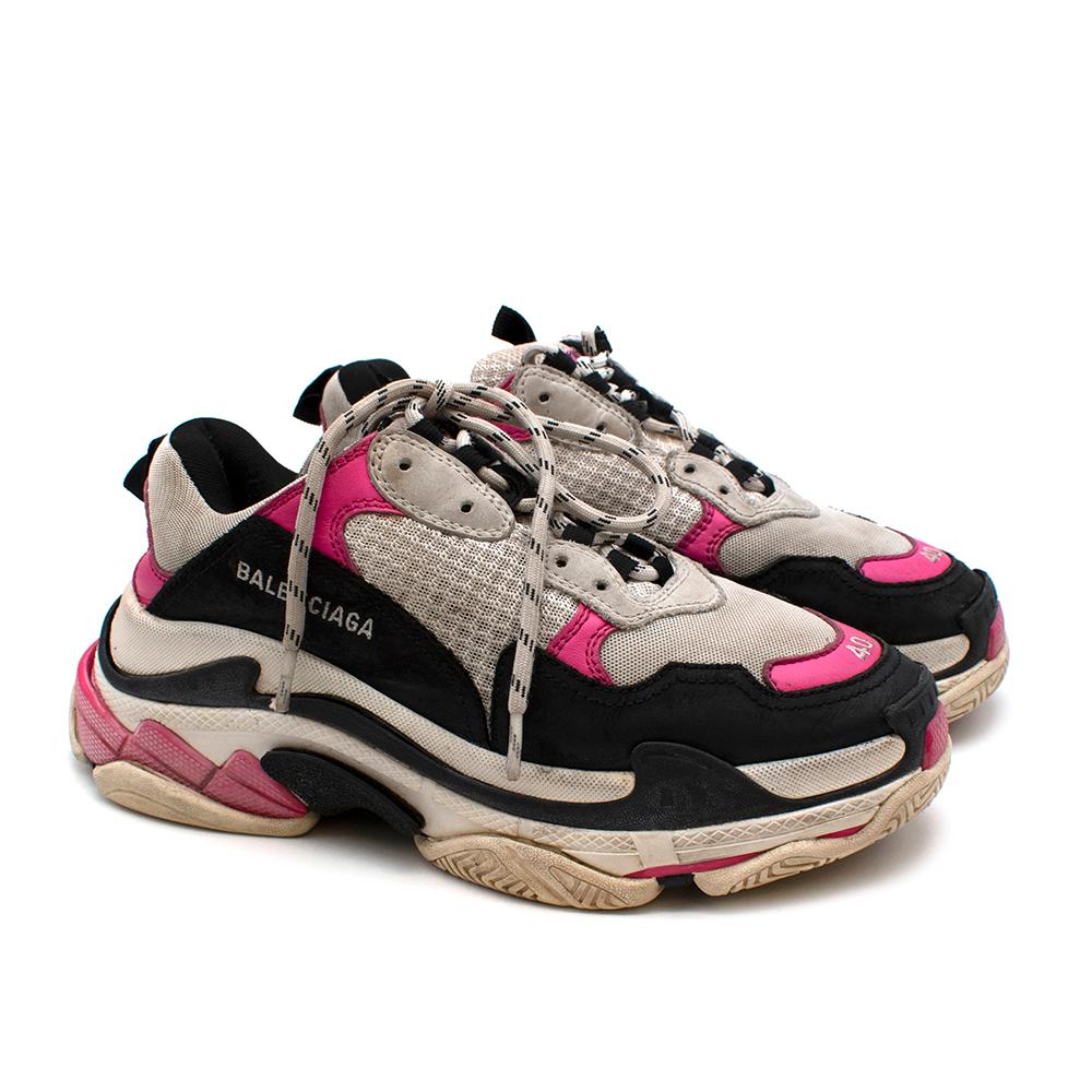 Balenciaga Black & Pink Triple S Trainers

Named after its signature triple-stacked rubber sole, these black leather Triple S lace-up sneakers from Balenciaga are just the pair to elevate your streetwear-inspired look.
Featuring a pull tab at the